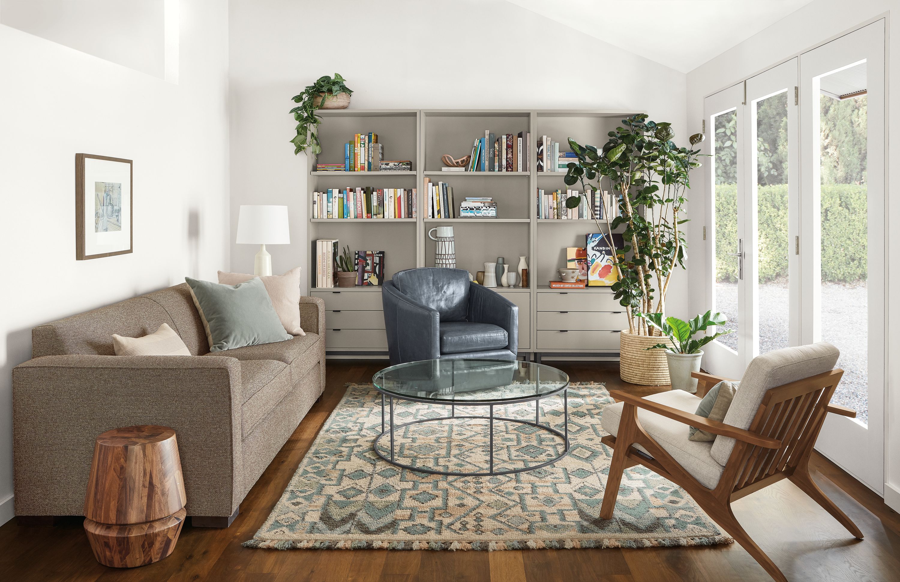 Detail of Ian sofa in Tatum Mink fabric in living room with Ona rug and Sanna chair.