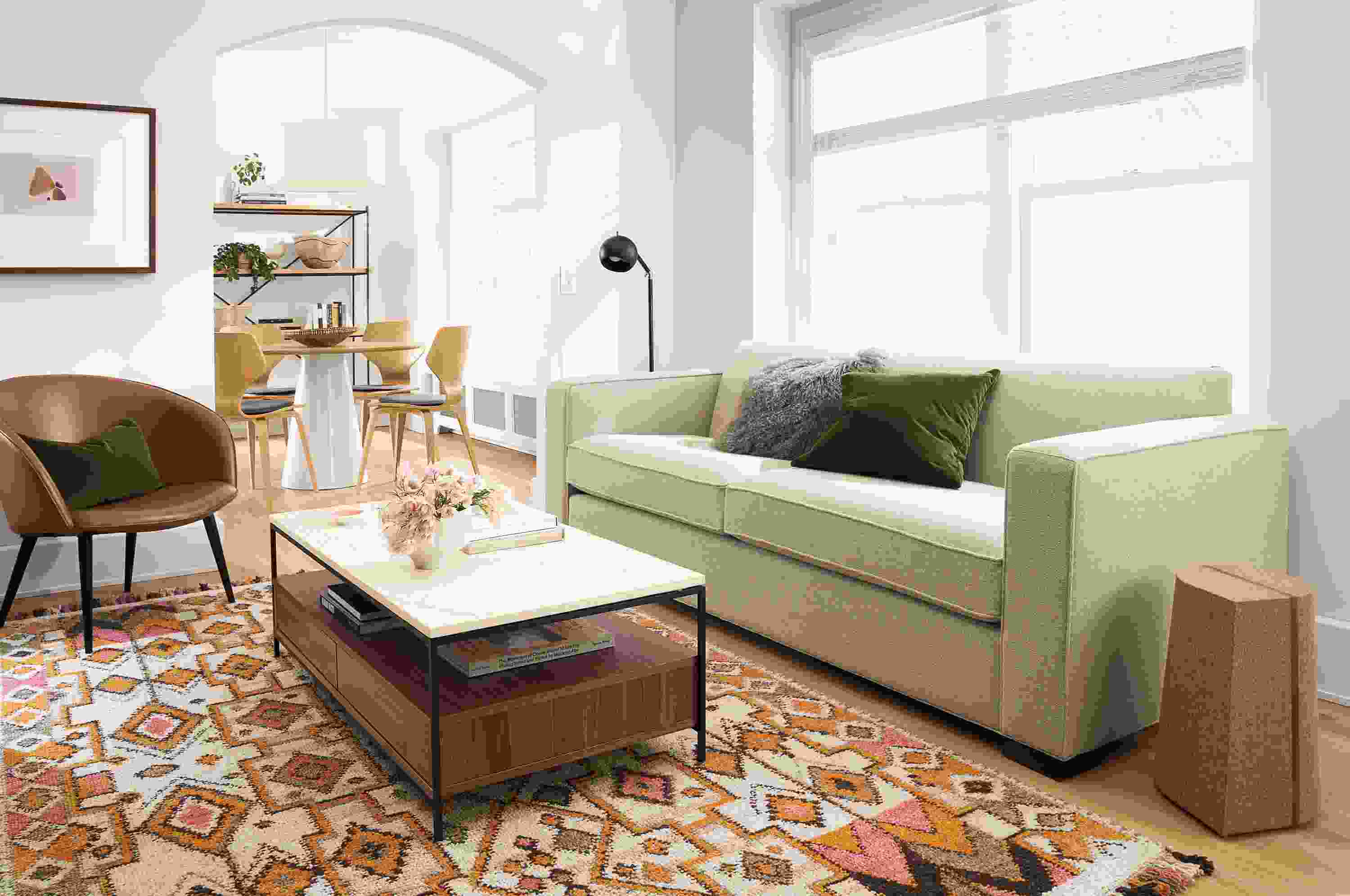 Living room with Ian sofa in Tatum Oatmeal and Williams coffee table in walnut with ecru quartz top.