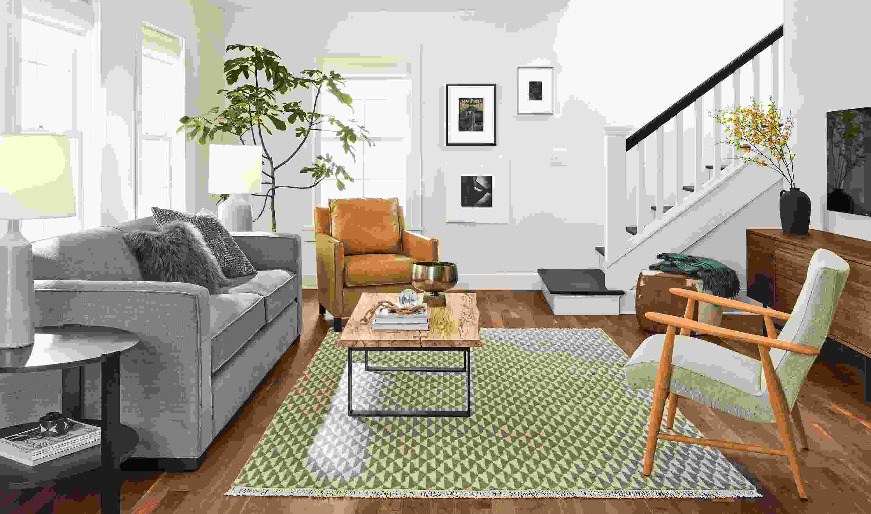 Living room with Ian sofa in Total Linen, Jonas Lounge Chair in Sumner Linen and Homage throw in Marine.