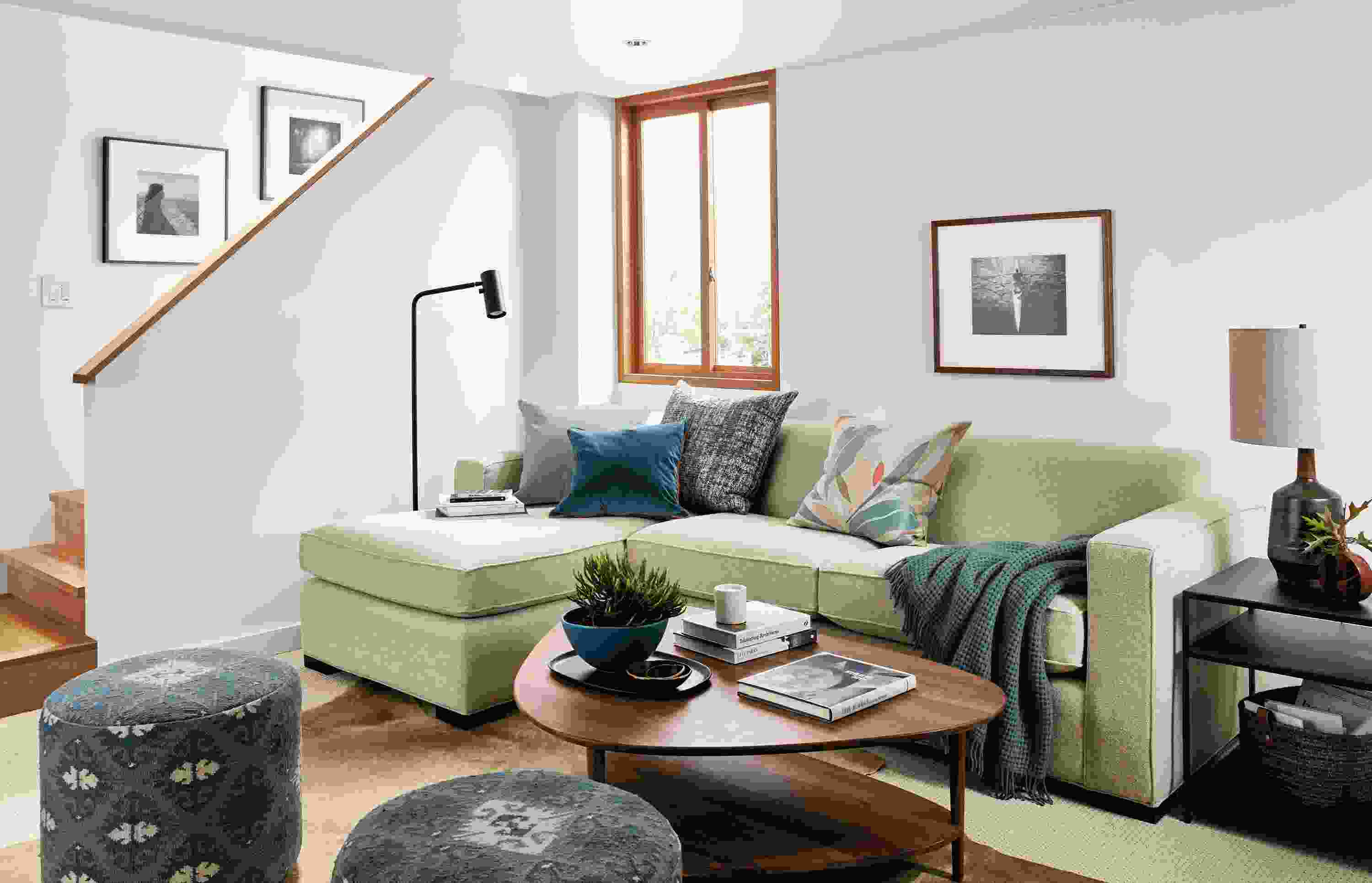 Living area with Ian 108-wide Sofa Chaise in Tatum Oatmeal Fabric with Gibson coffee table in walnut.