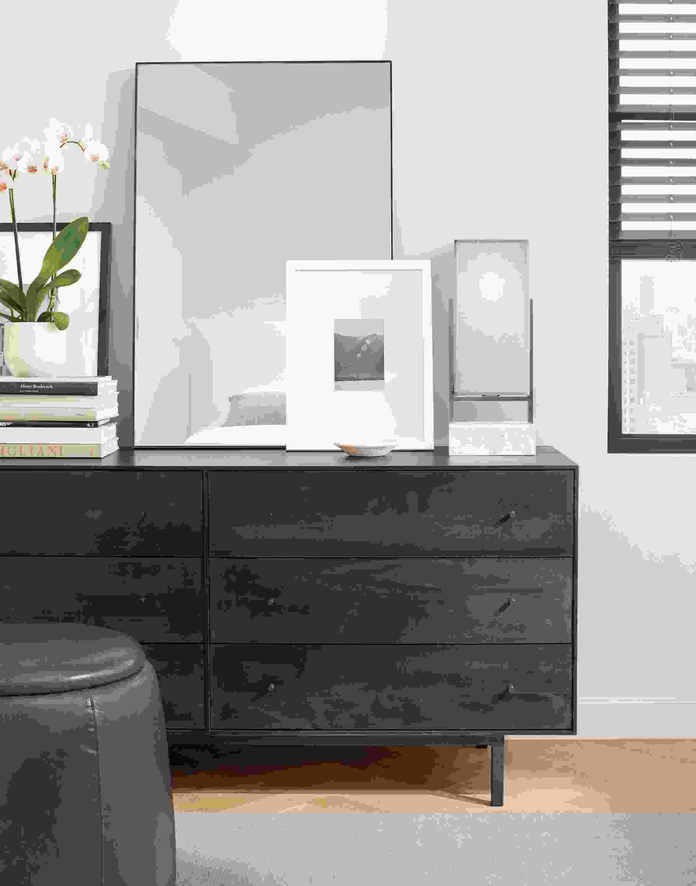Bedroom with Infinity 24 by 36 mirror in graphite, Hudson dresser in charcoal on maple and Glenn rug in cement.