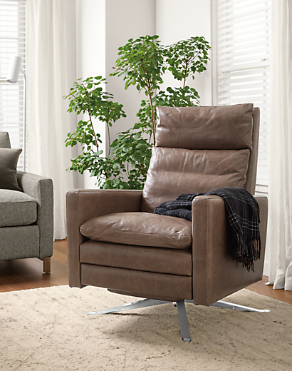 Detail of Isaac thin-arm recliner with metal swivel base.