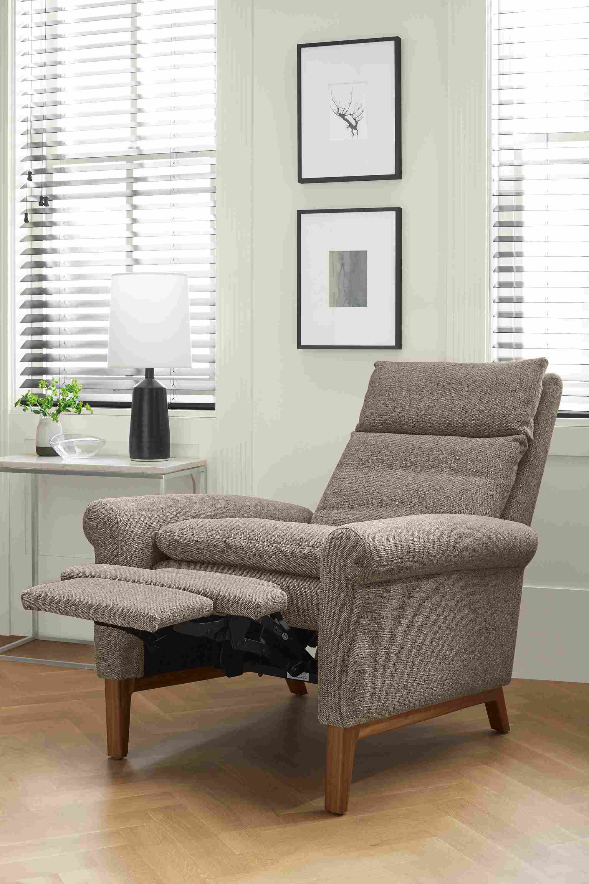 Detail of Isaac rolled-arm recliner in Tatum Grey and walnut shown with foot rest extended.