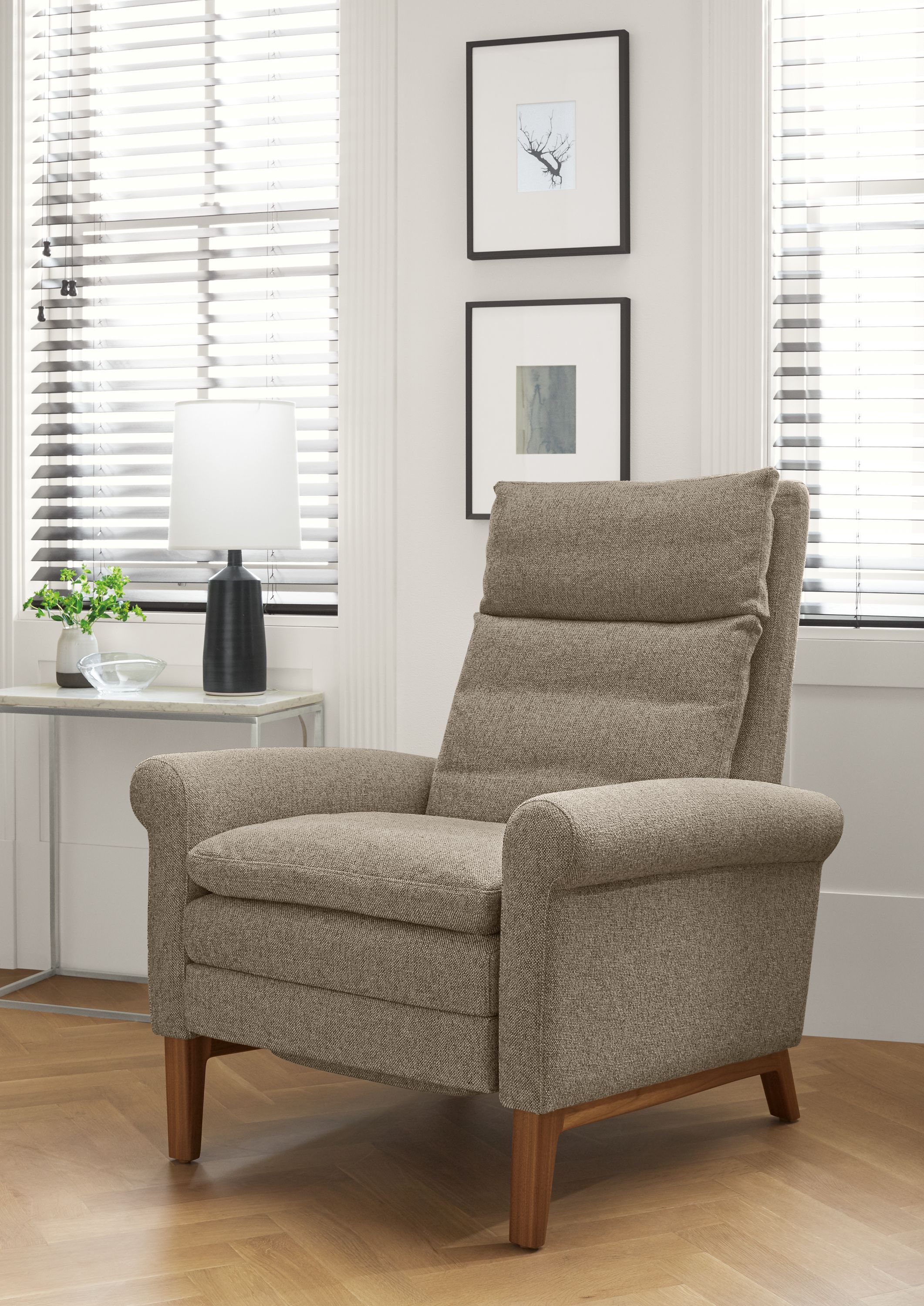 Detail of Isaac rolled-arm recliner in Tatum Grey with walnut base.