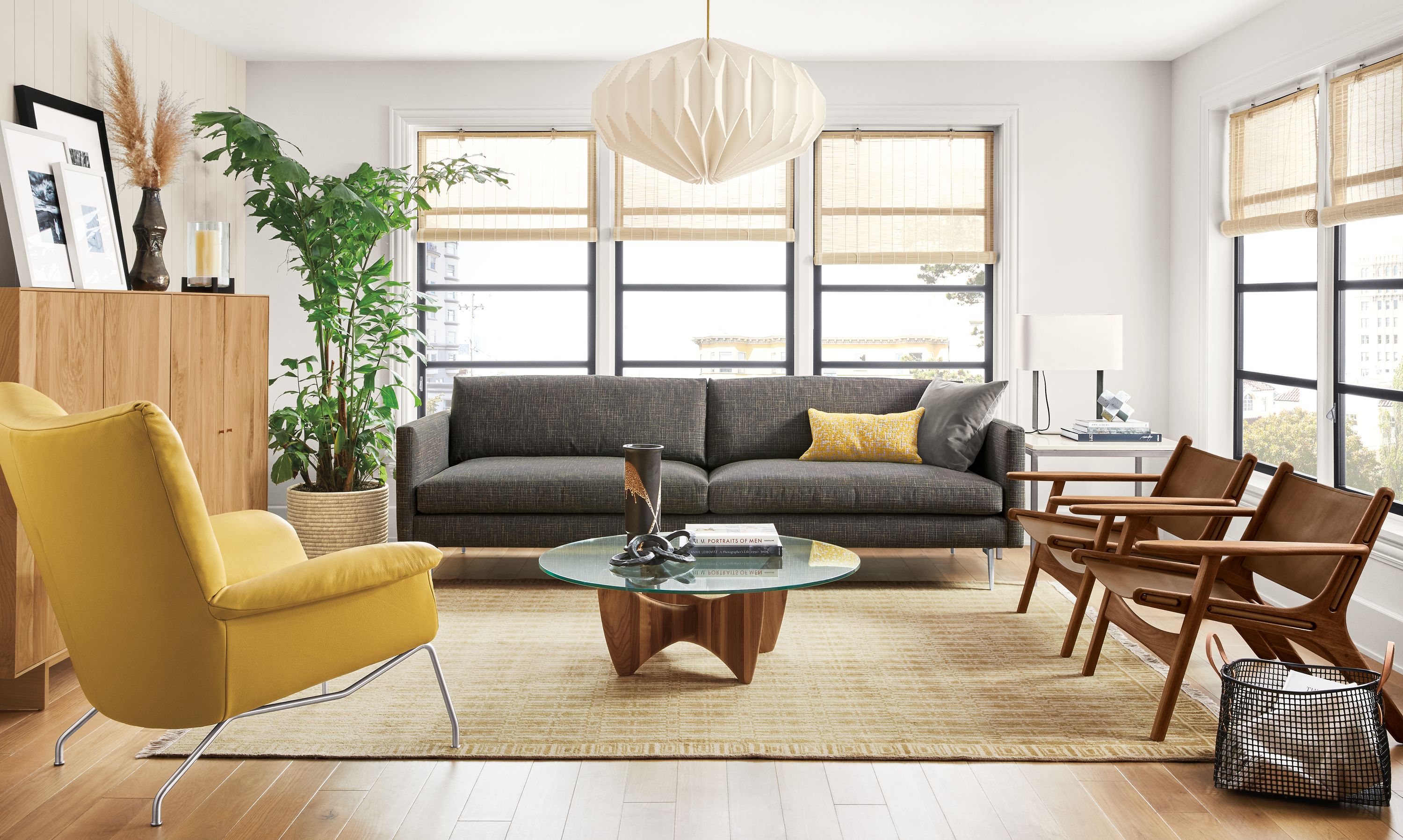 Detail of Janus sofa in Harrow Charcoal fabric in living room with Paris chair.