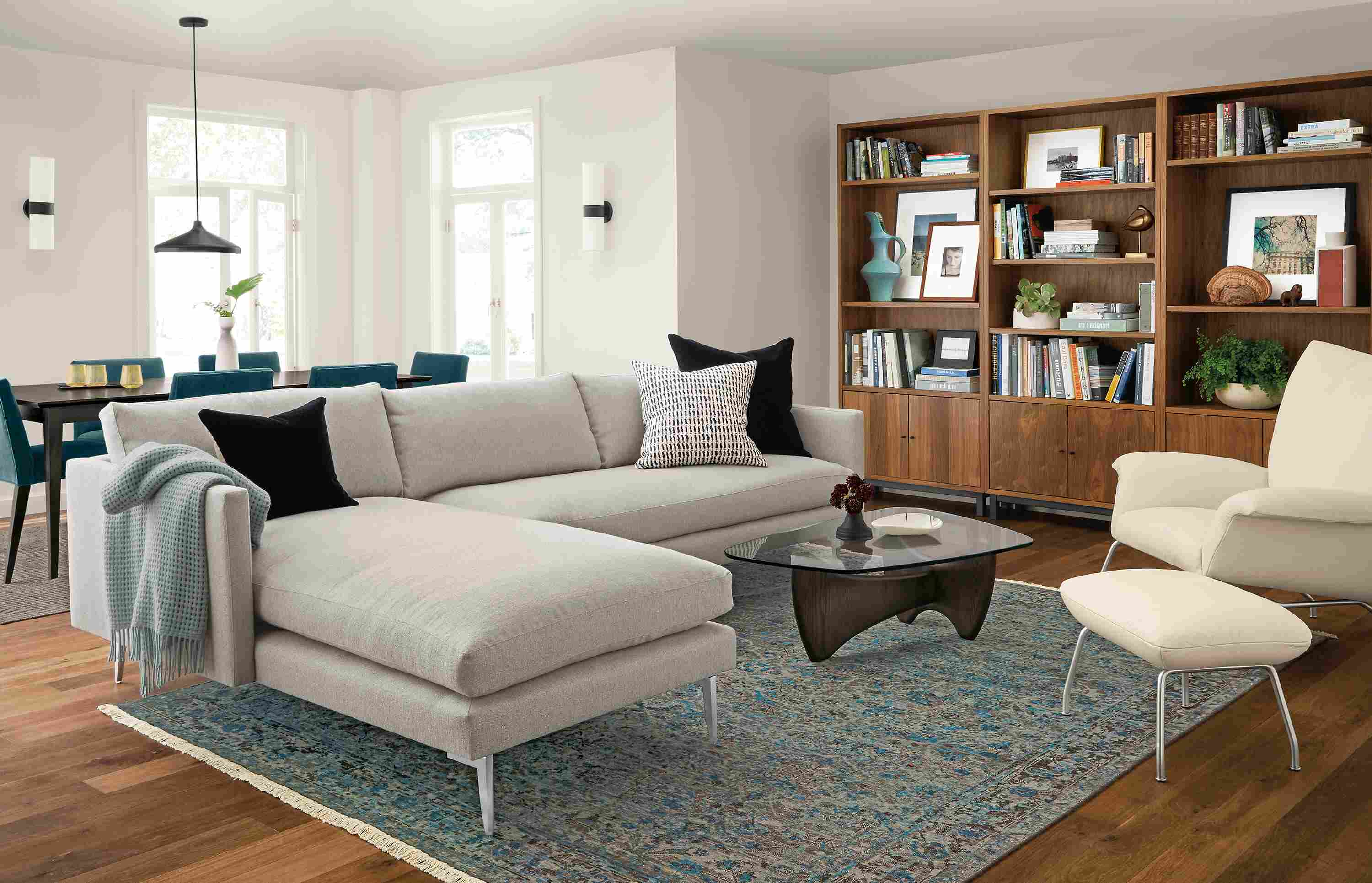 Janus 111-sofa with left-arm chaise in Hines Grey and 3 Copenhagen bookcases in walnut.