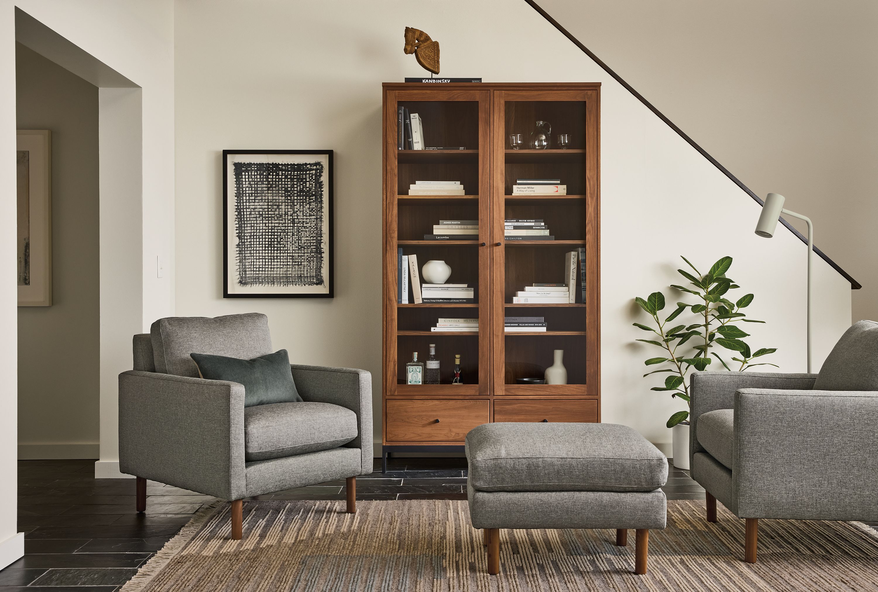 27"w ottoman in Sumner graphite fabric and walnut leg