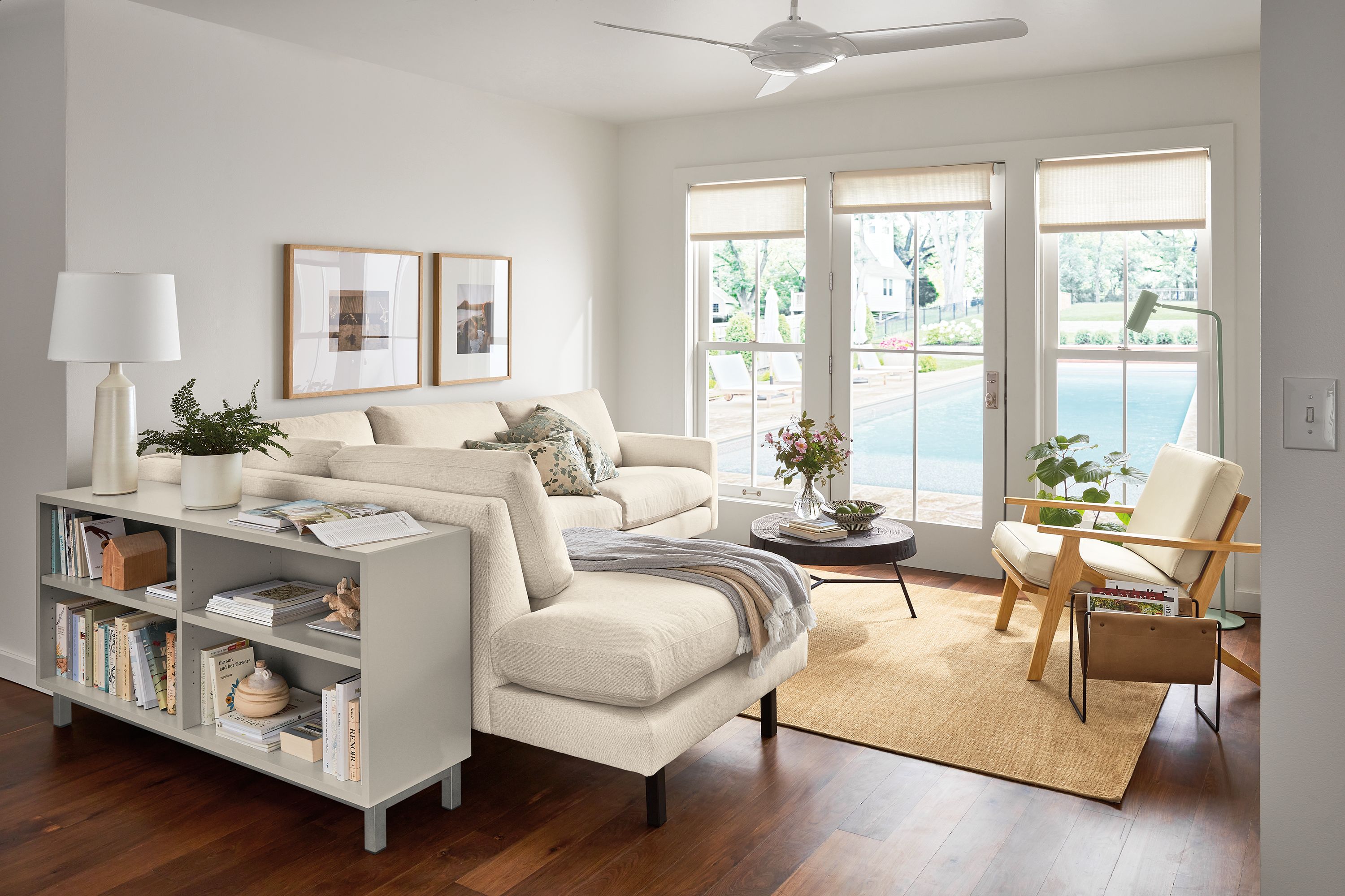 living room with jasper sofa, sanna leather chair, copenhagen console bookcase.