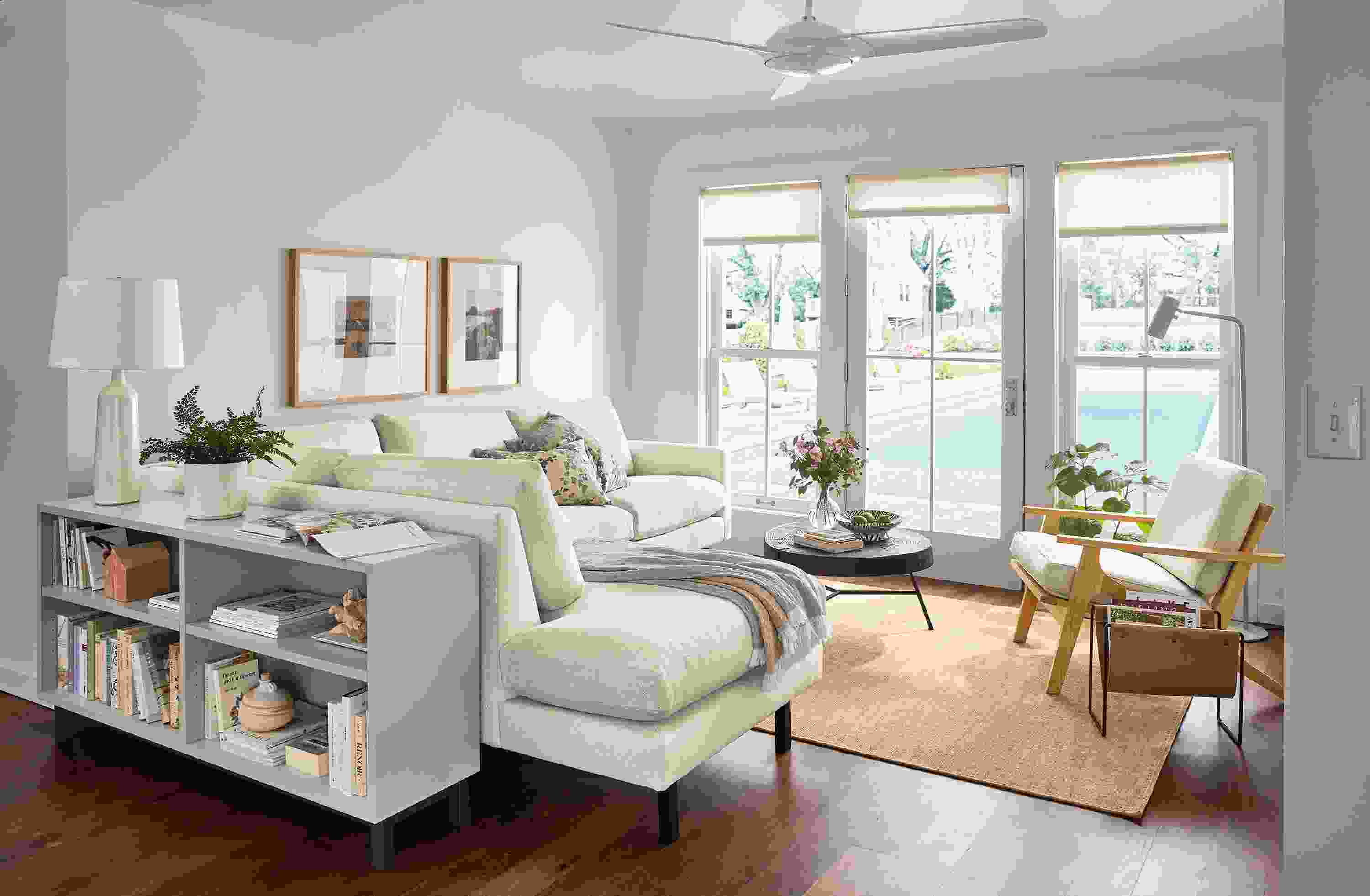 Living room with Jasper sofa in Sumner Ivory, Sanna leather chair, Copenhagen console bookcase in taupe.