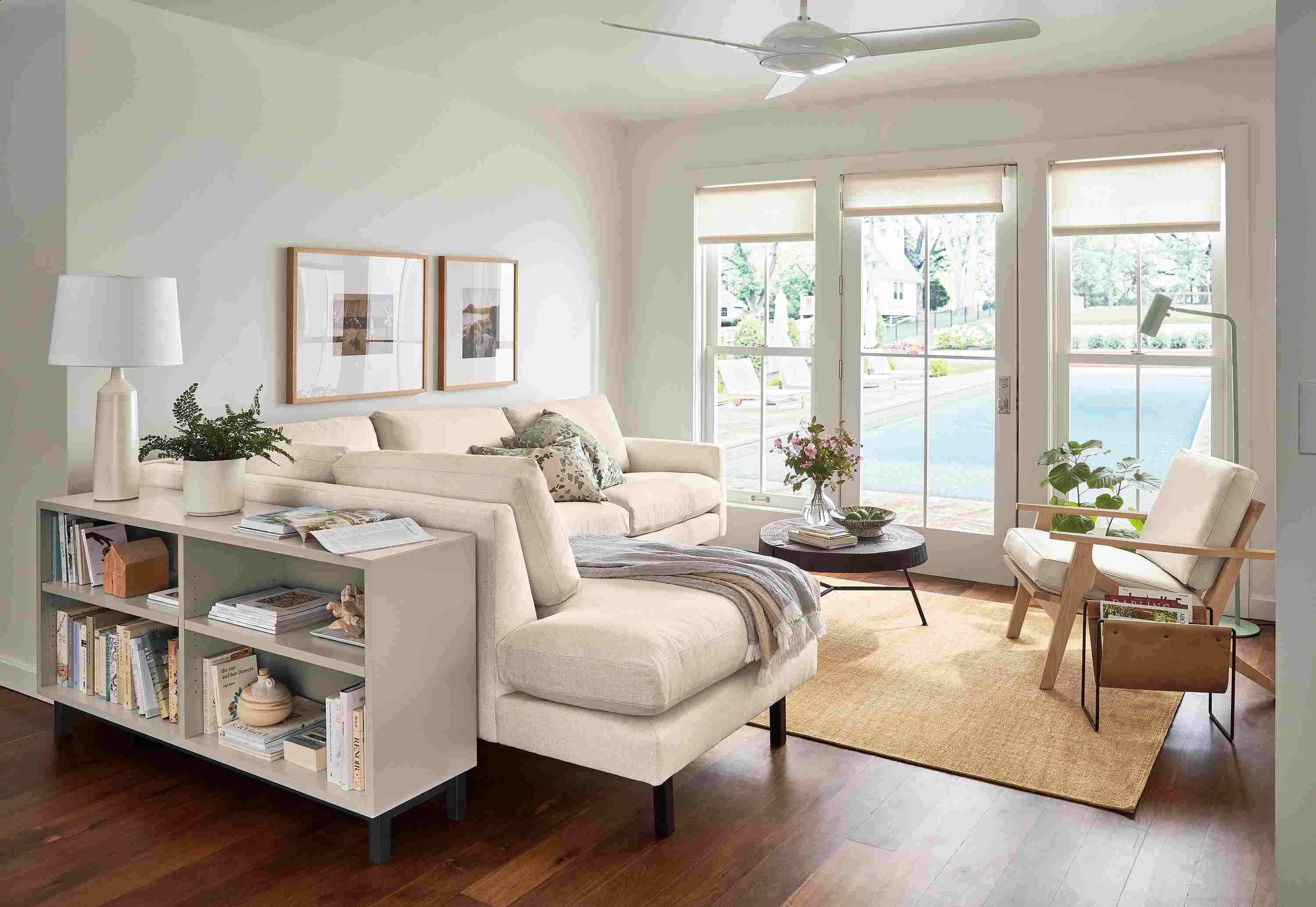 living room with jasper sofa, sanna leather chair, copenhagen console bookcase.
