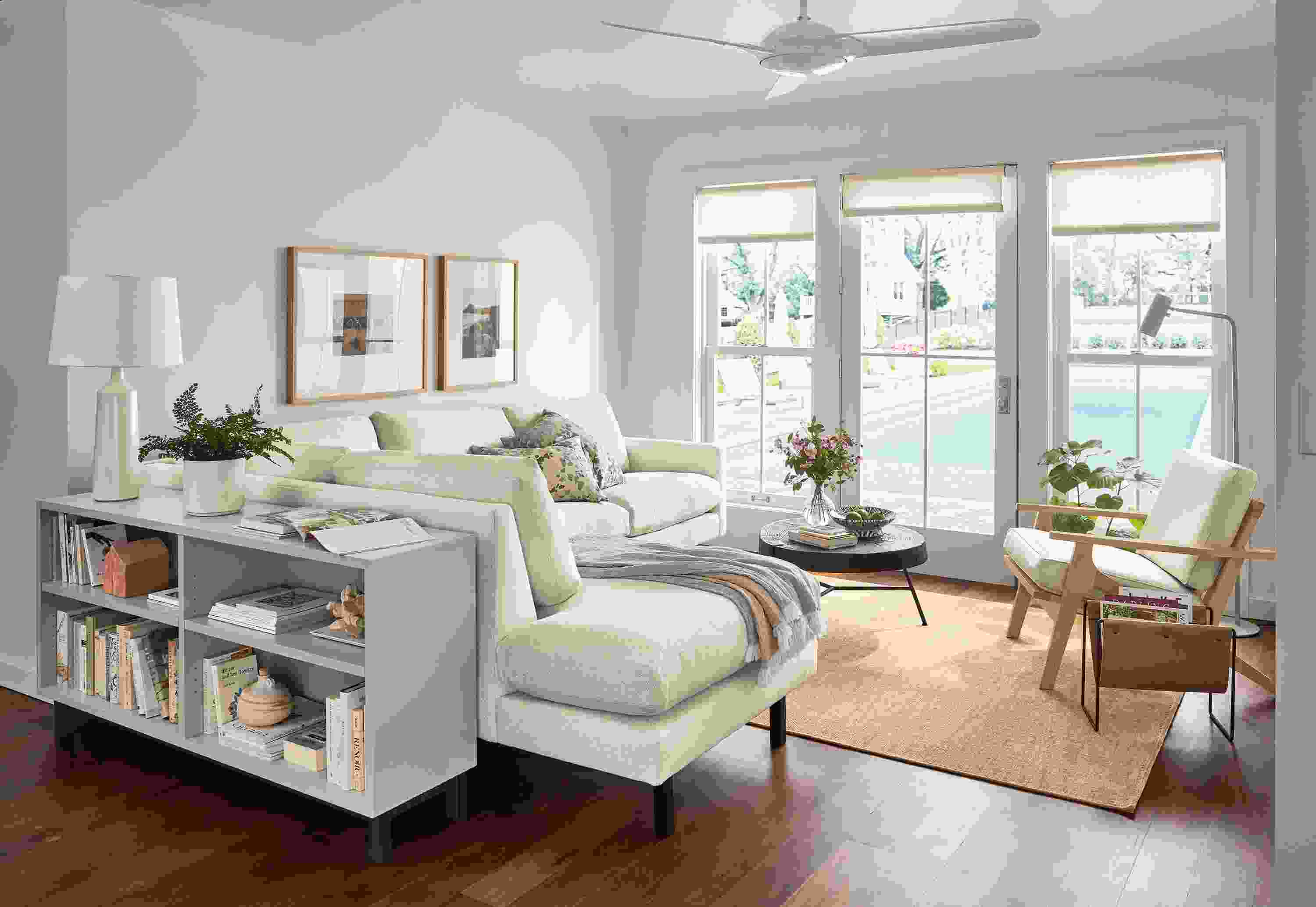 living room with jasper sofa, sanna leather chair, copenhagen console bookcase.