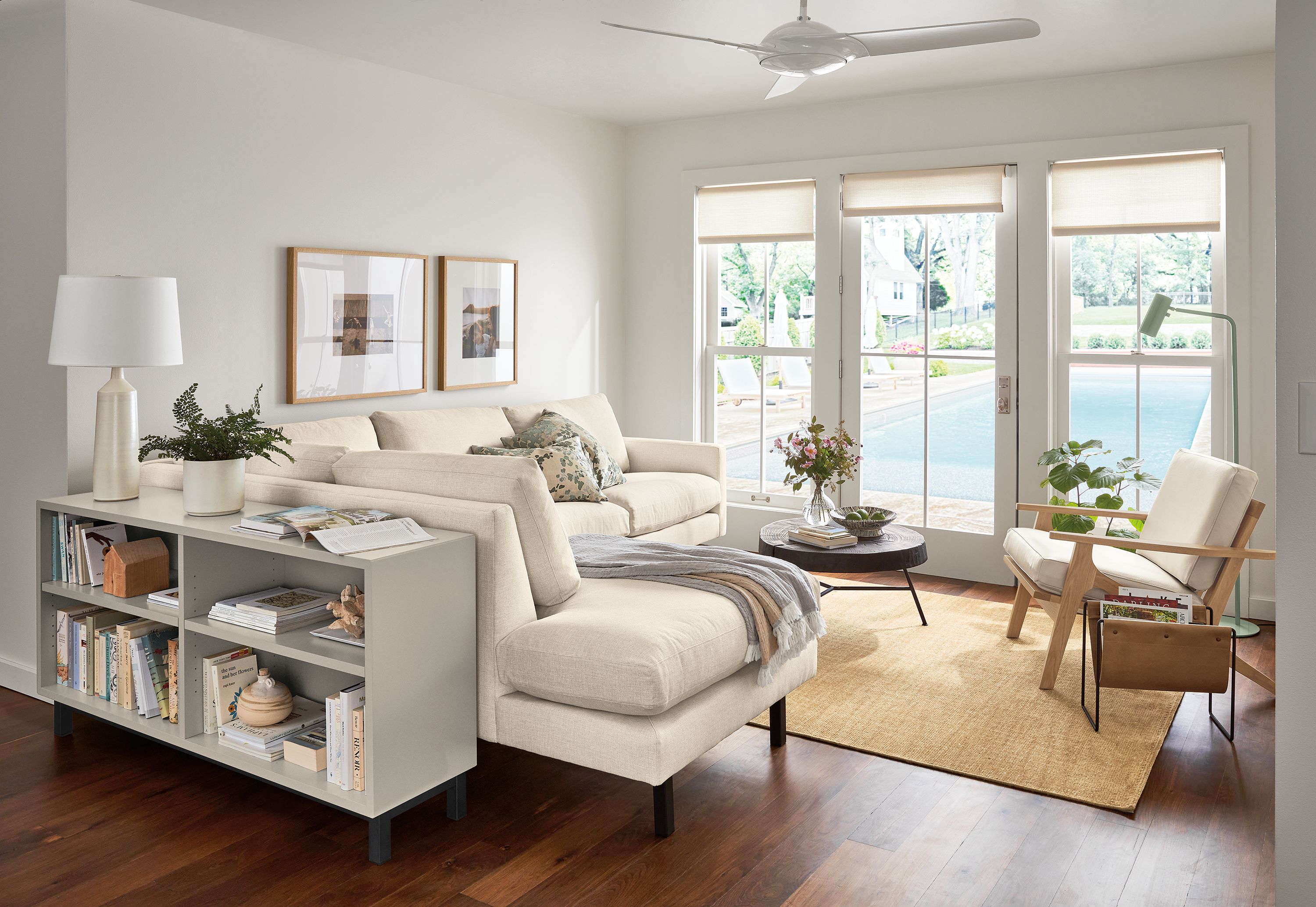 living room with jasper sofa, sanna leather chair, copenhagen console bookcase.