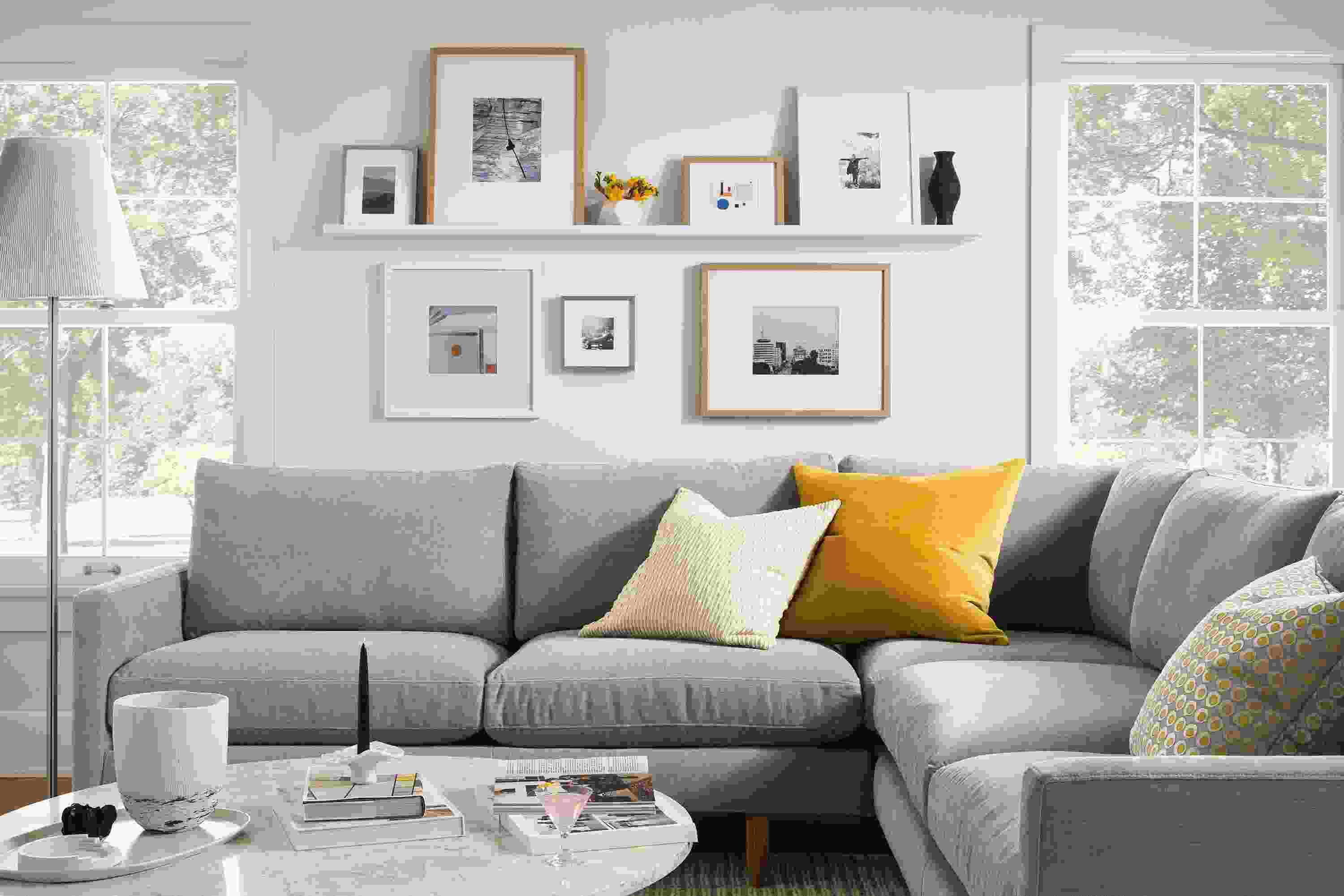 Living room with Jasper sectional sofa in Mori Cement and Aria coffee table with Marbled White Quartz top.