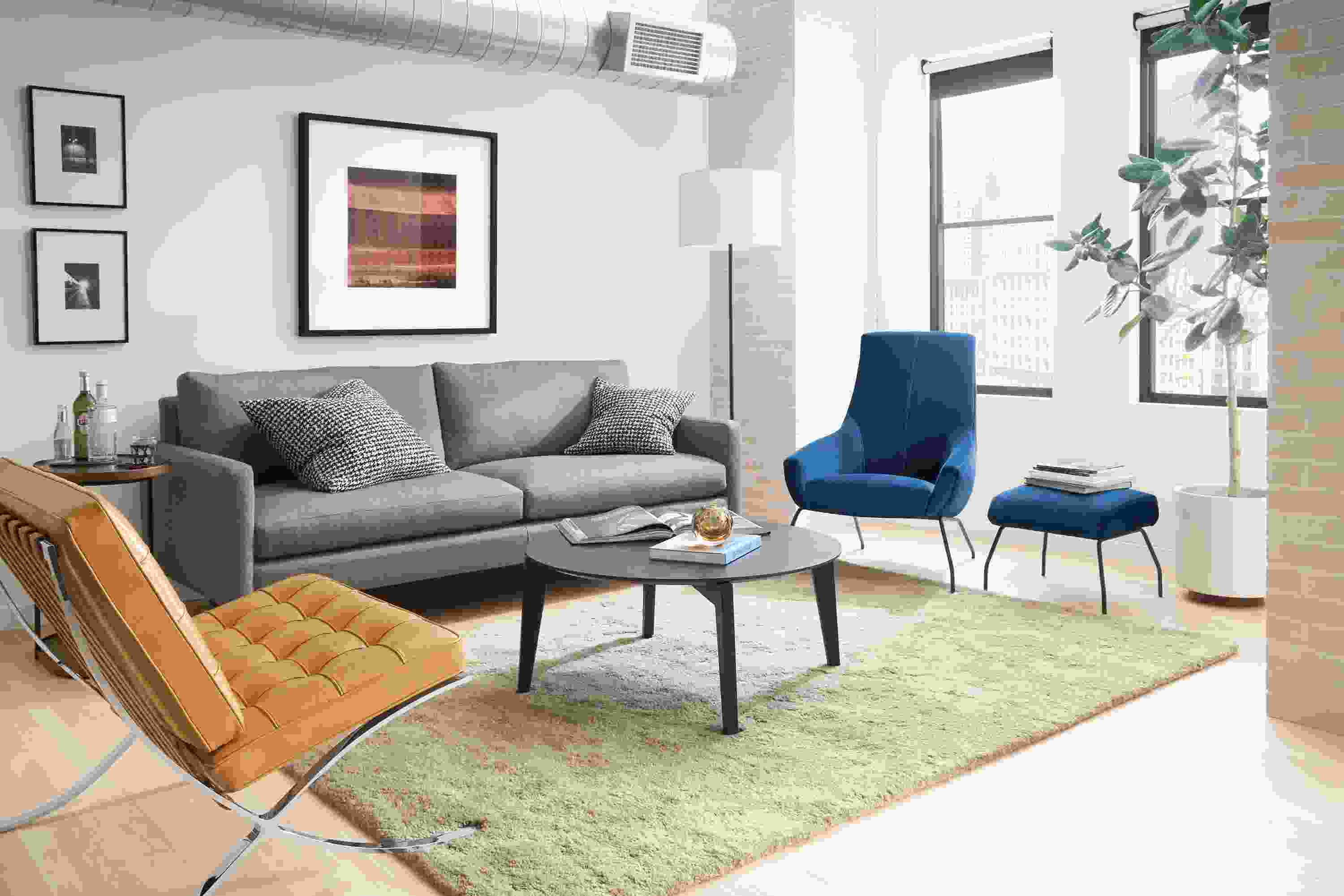 Living room with Jasper sofa in Sumner Graphite, Rhodes lounge chair in Vance Indigo and Seville Chair.