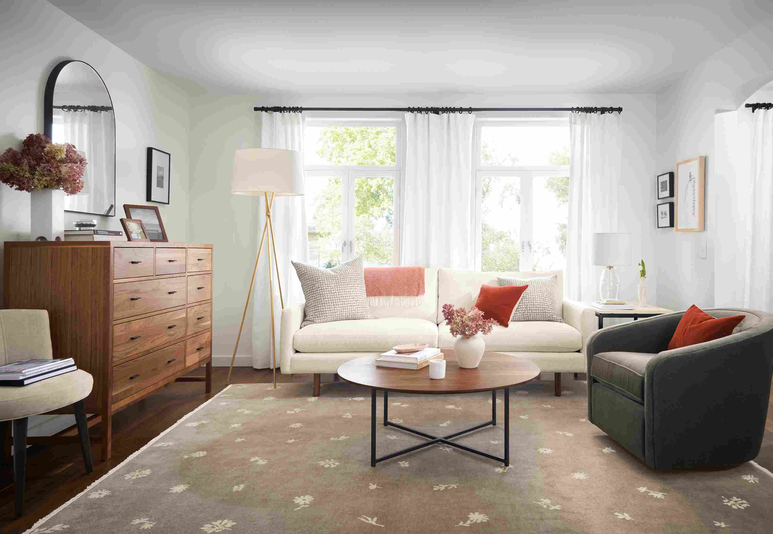Living room with Jasper sofa in white, Tansy rug in Taupe/Ivory, and berekely storage cabinet in walnut.
