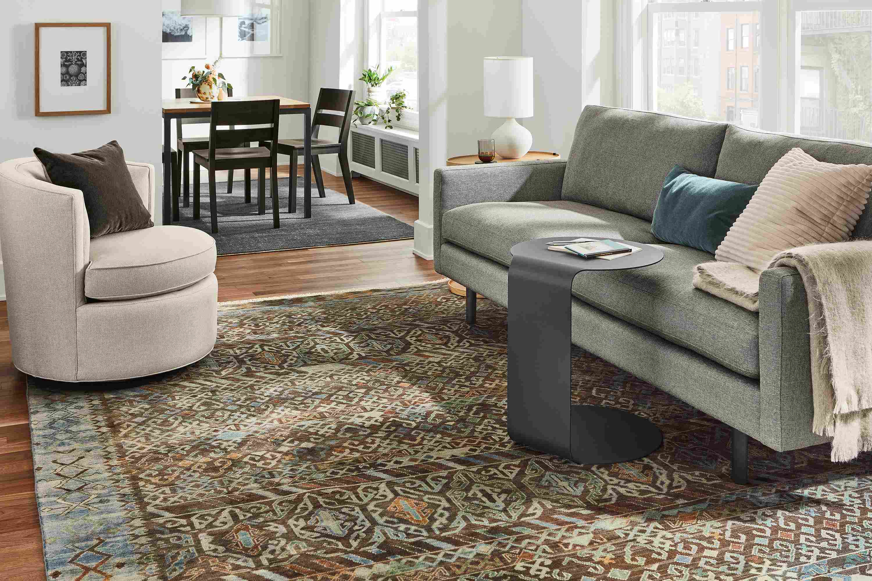Jasper sofa in Sumner Graphite in living room with c-table and Otis swivel chair in Gino Oatmeal.
