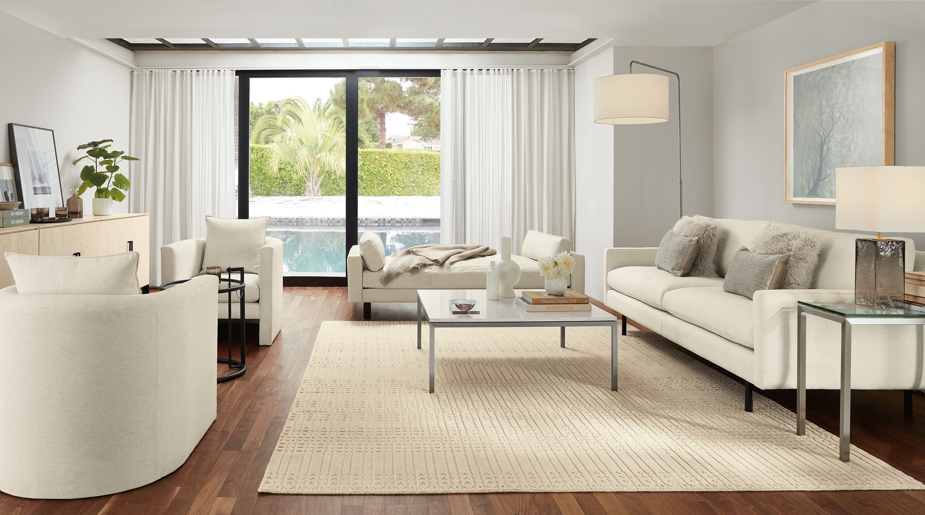 Living room with Jasper sofain Sumner Ivory, Pierson daybed in Vento Ivory and Bria rug in ivory.