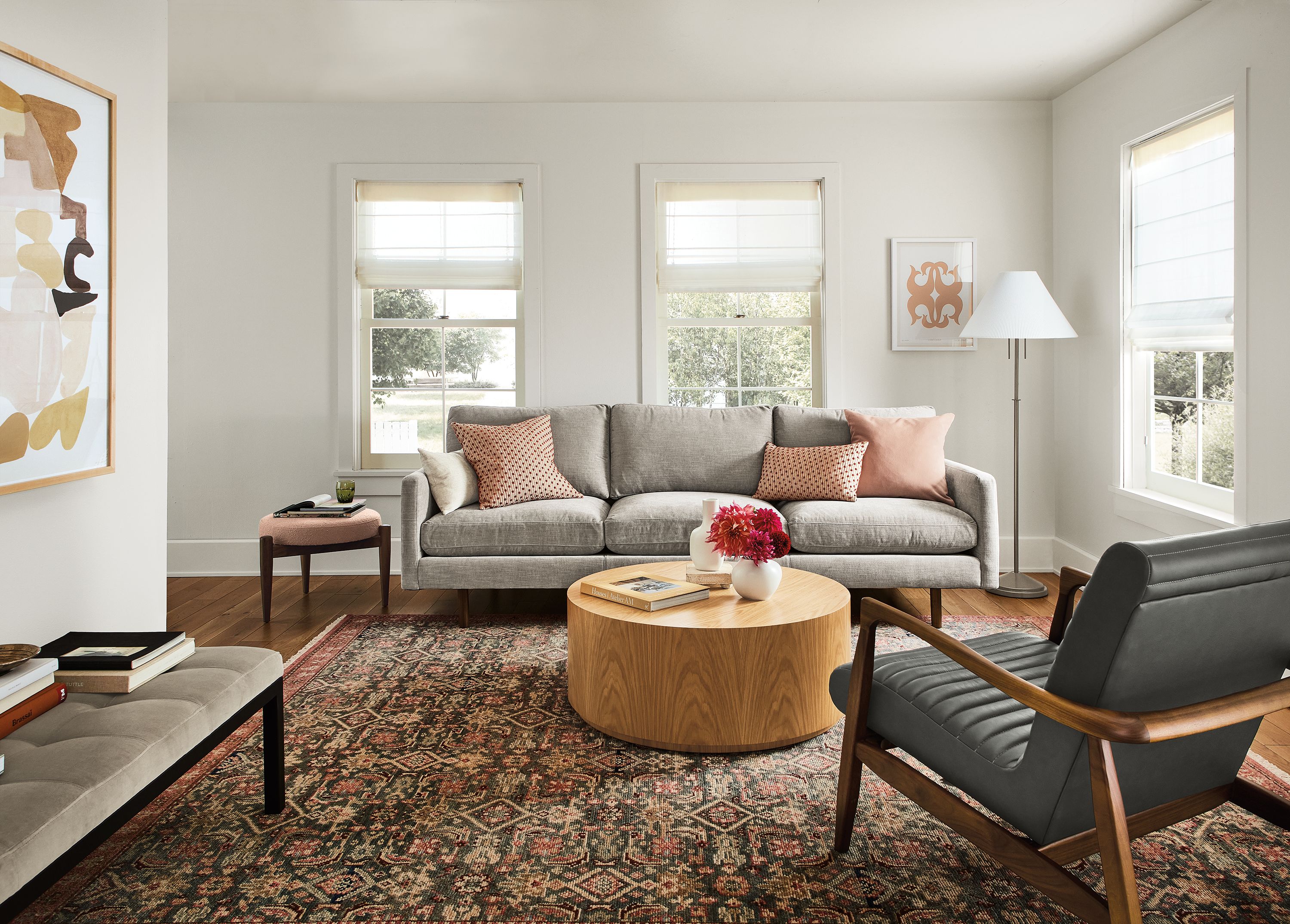 living area with jasper sofa in mori cement fabric, callan chair in laino slate leather and liam coffee table in white oak.