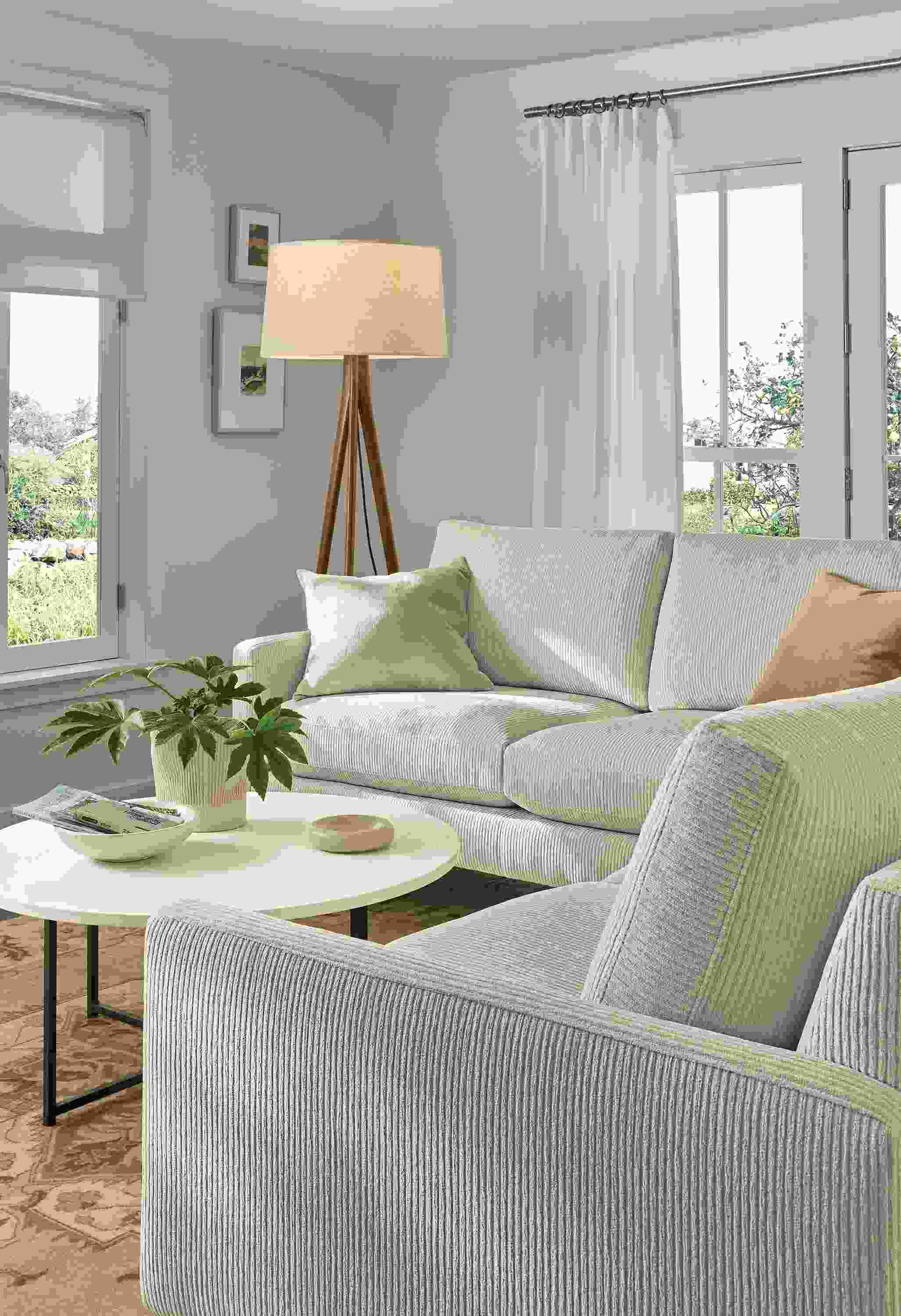 Living room with Jasper 103 by 103 sectional in Brava Ivory and Classic round coffee table with marble ivory quartz top.