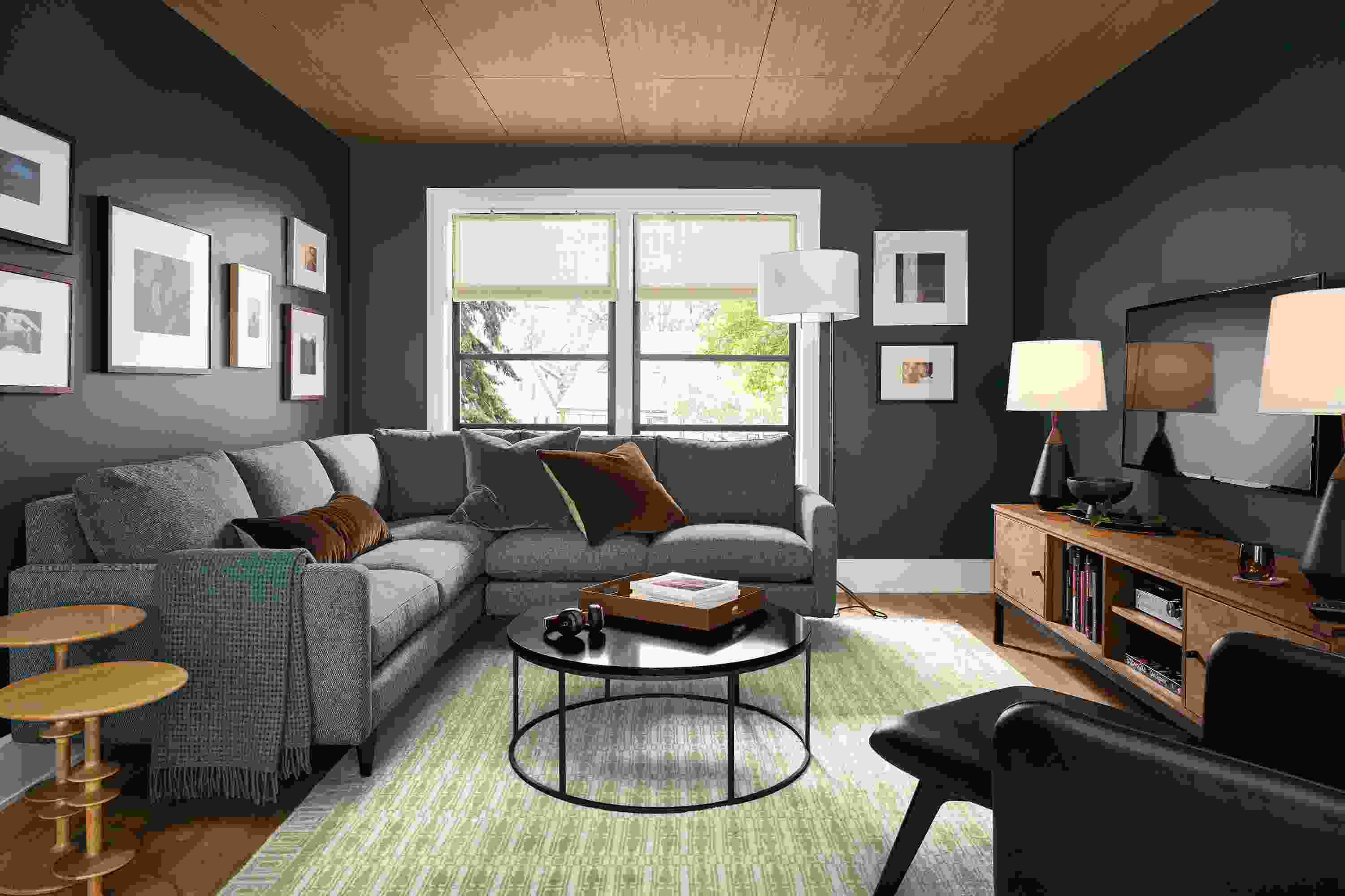 Living room with Jasper 2-piece left arm corner sofa in Tepic Haze and Hilliard chair in Lecco Black leather.