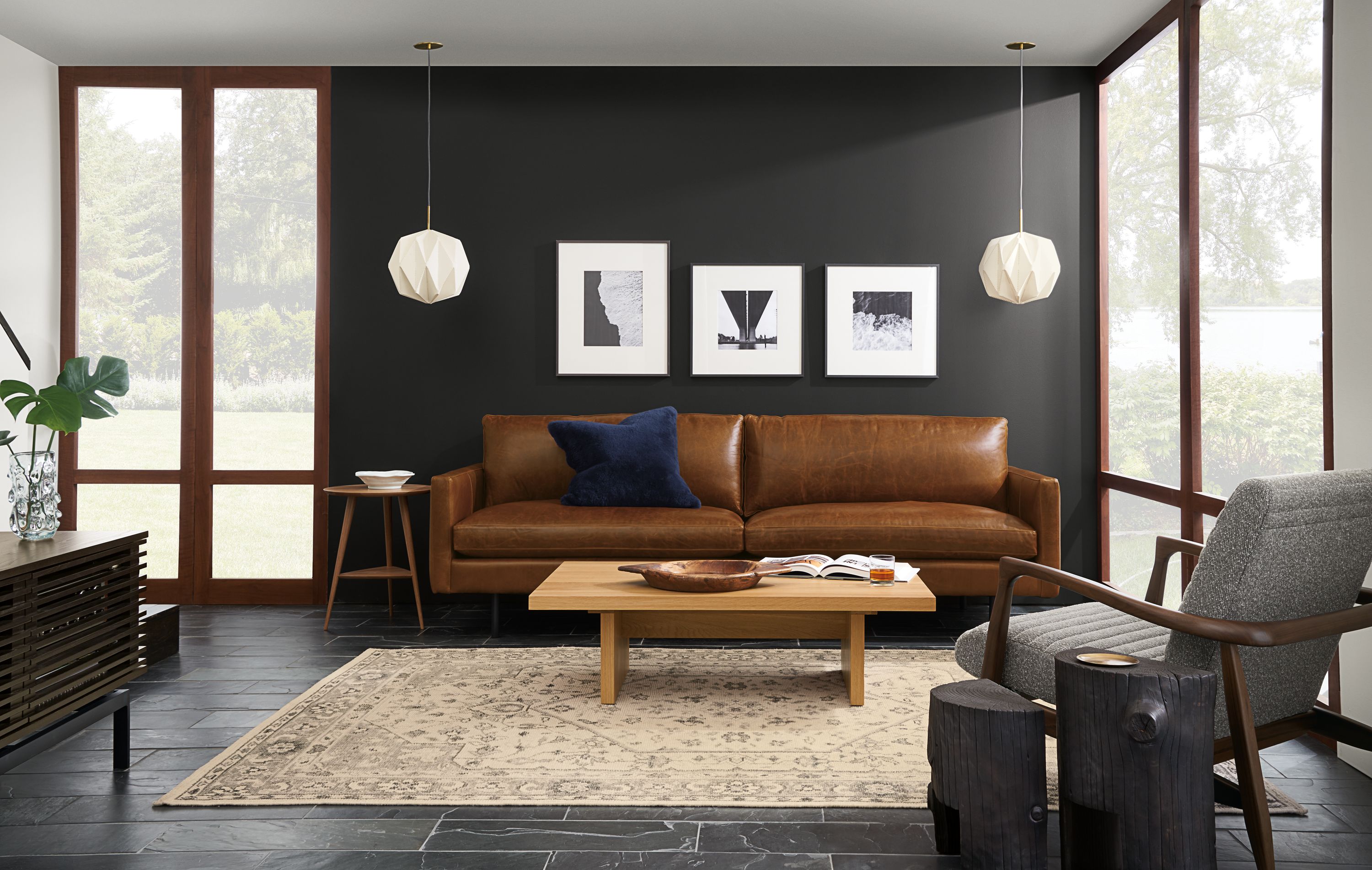 Living room with Jasper 86-wide sofa in Vento Cognac leather, Callan chair in Conley Graphite.