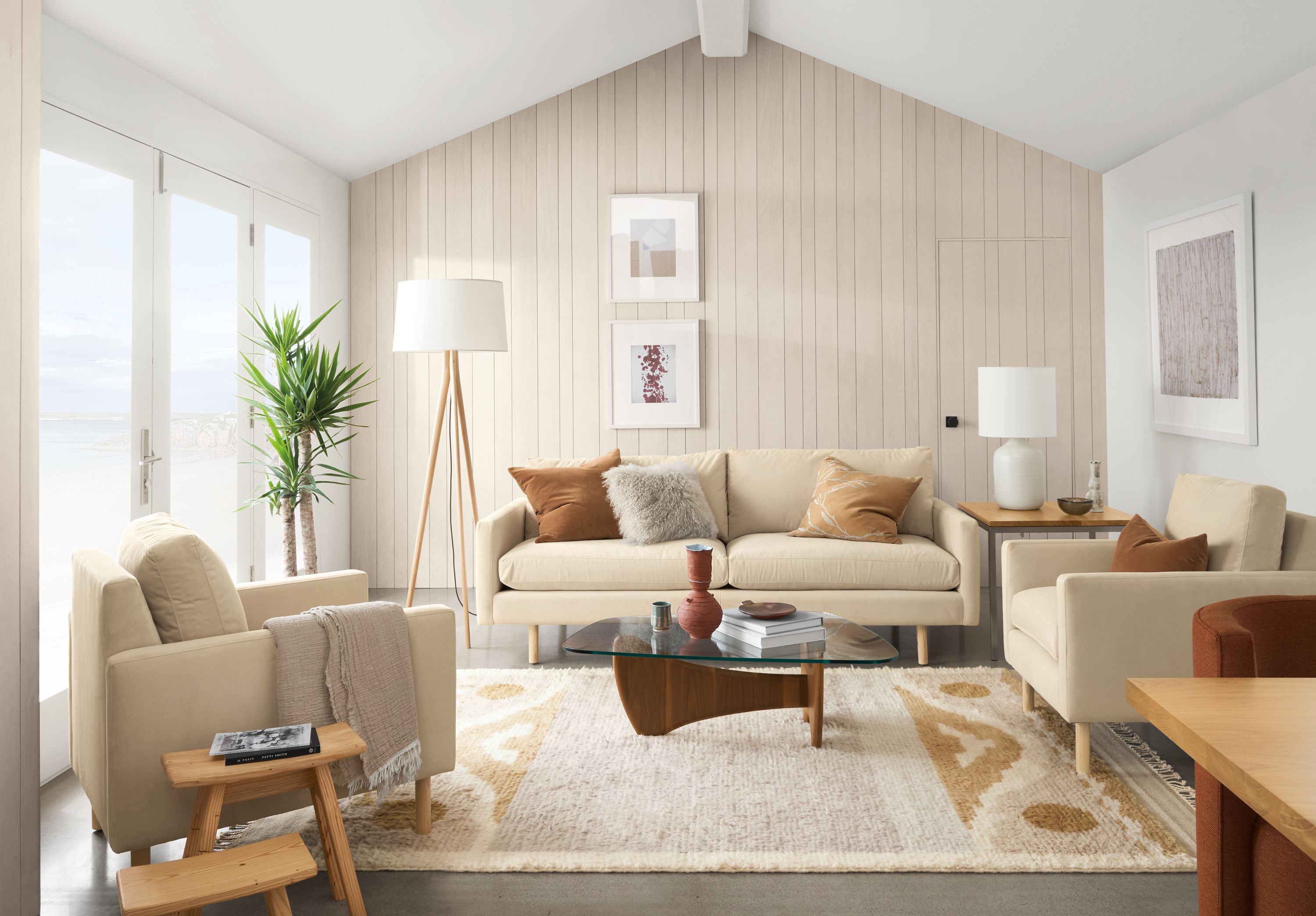 Jasper sofa and chair in View Wheat, Sanders coffee table in walnut and Tova rug in sand.