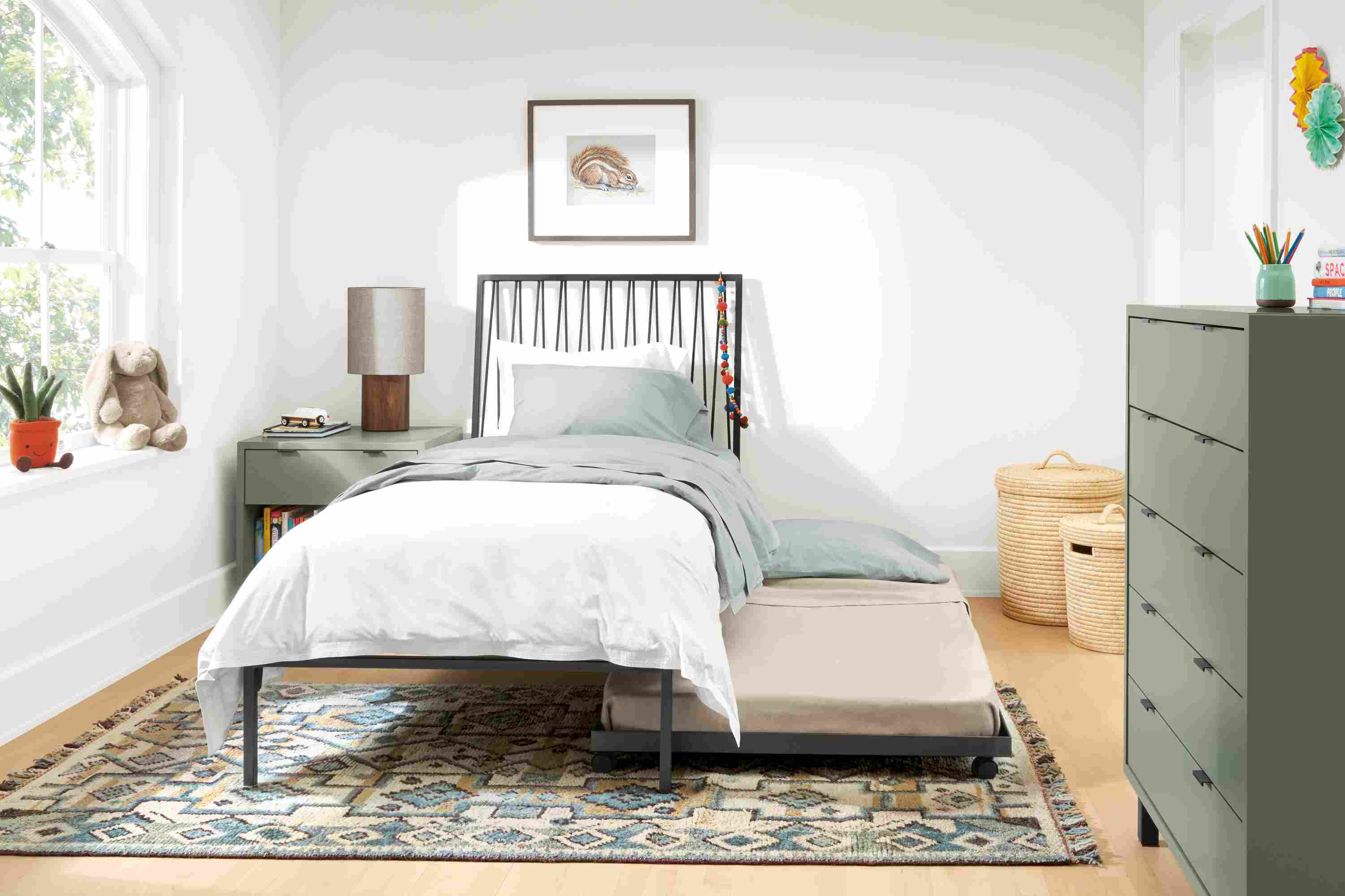 Detail of Jennings twin bed with trundle under bed in a child's room.