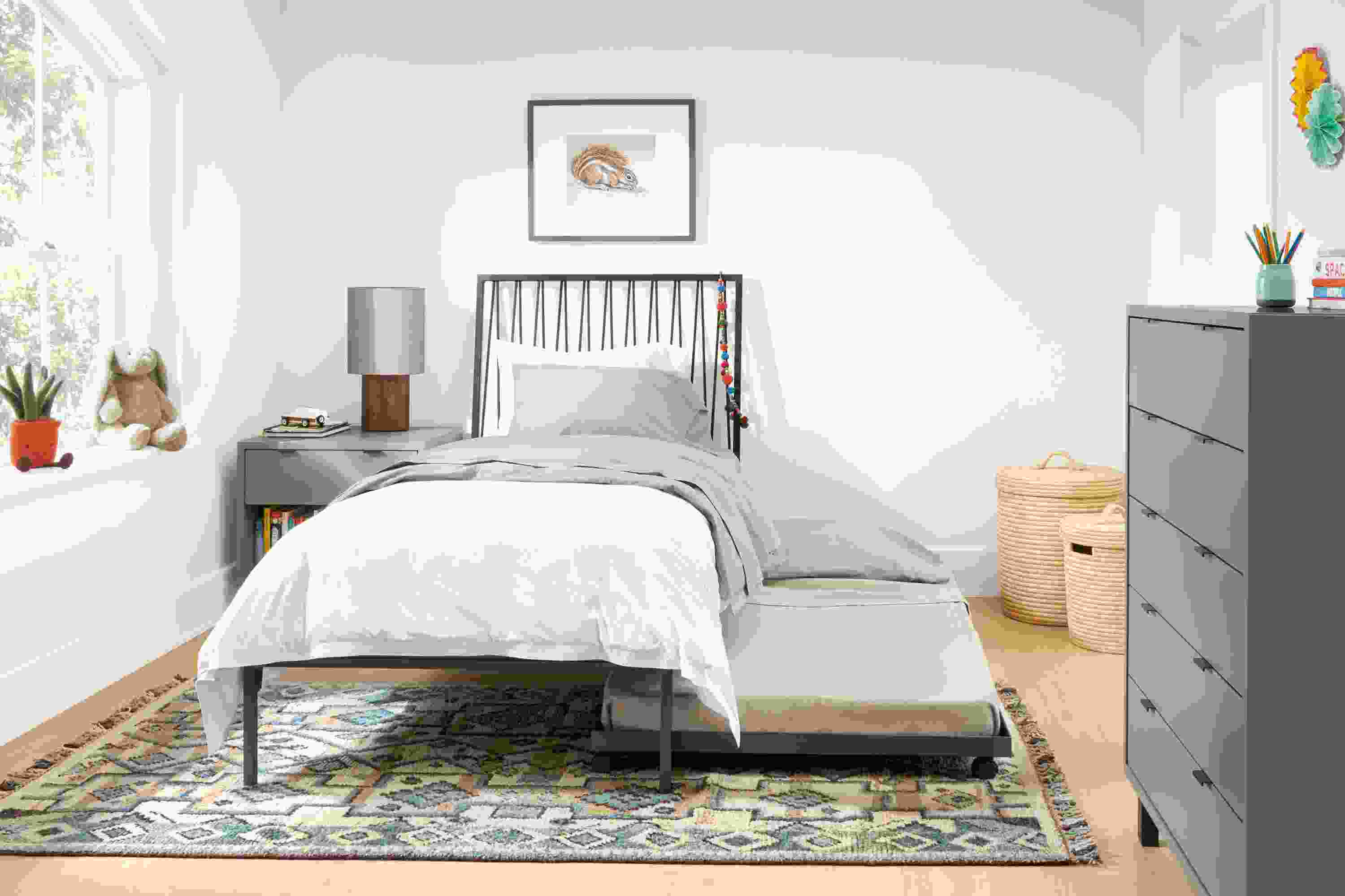 Detail of Jennings twin bed with trundle under bed in a child's room.