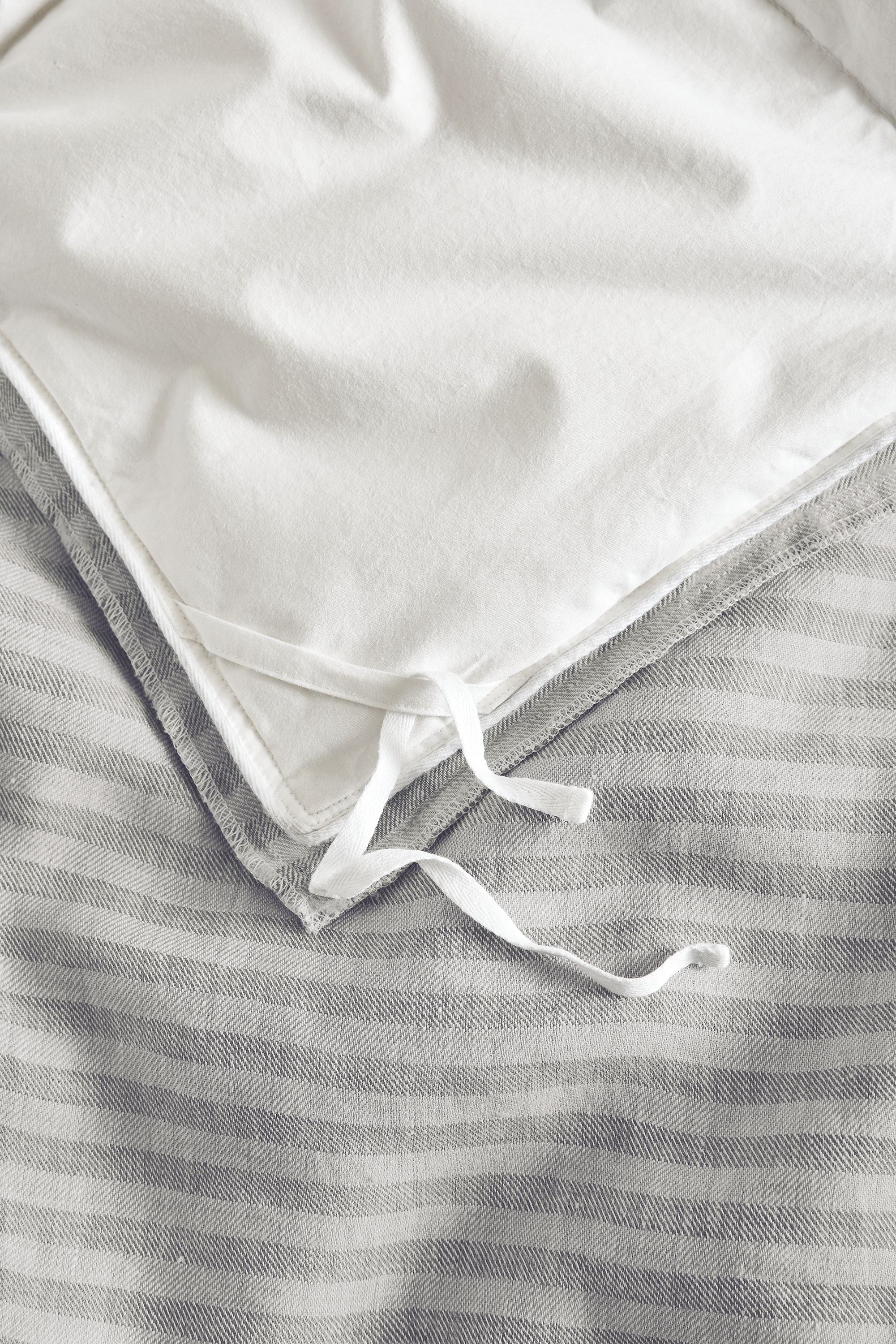 Detail of ties on Jenson linen full/queen duvet set in grey.