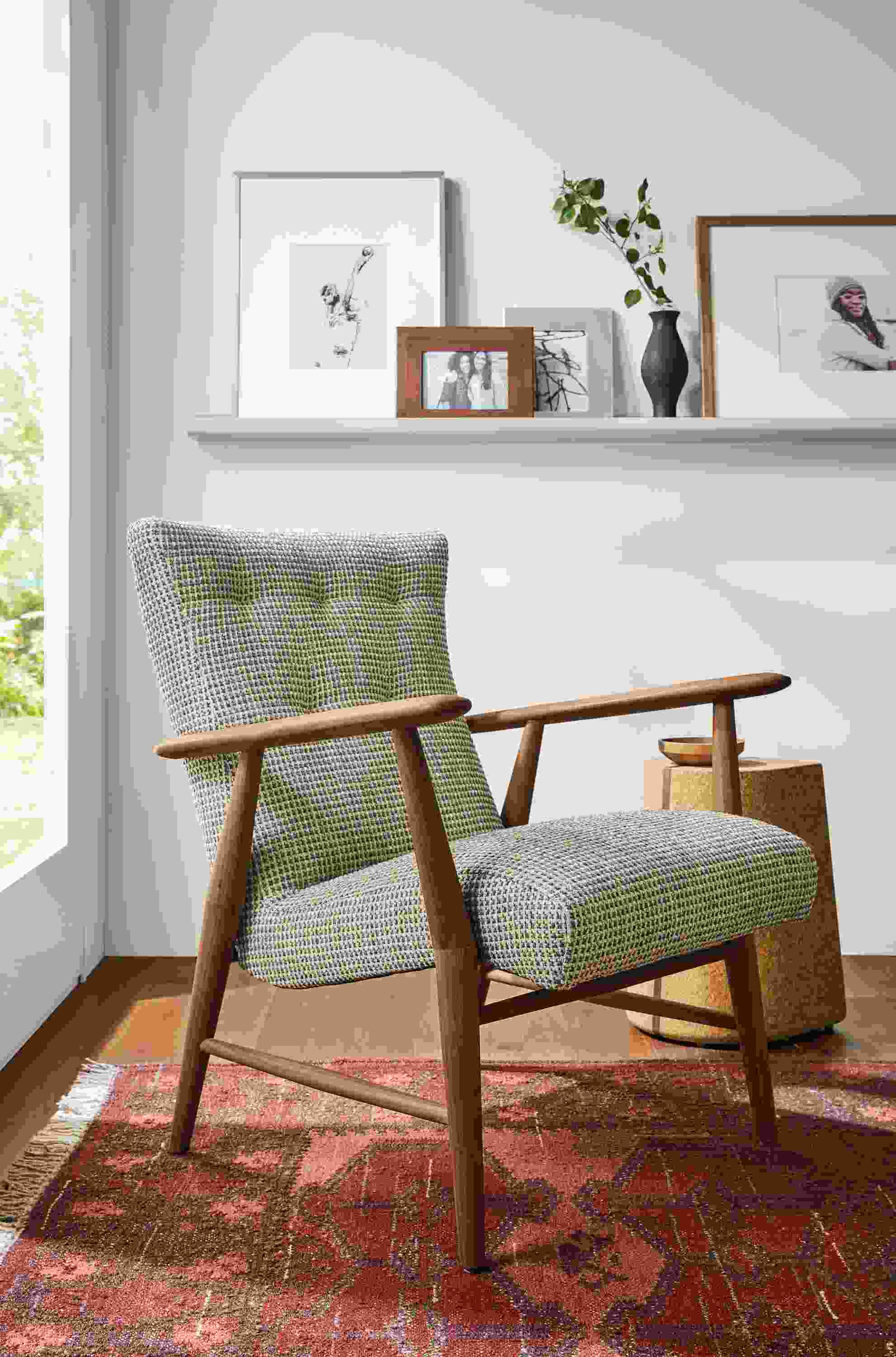 Detail of Jonas lounge chair in Hearth Grey fabric beside Corkdrop end table.