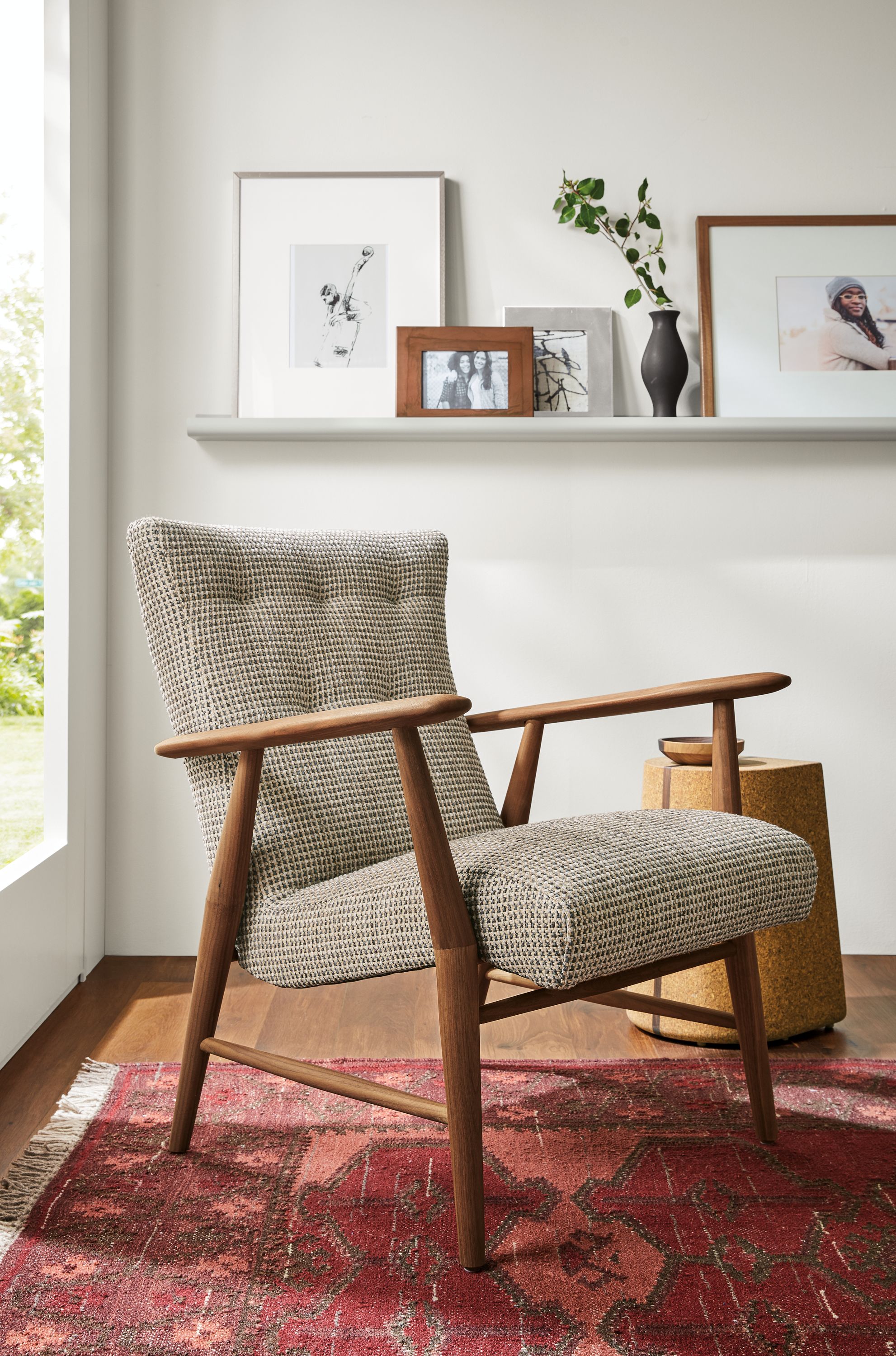 Detail of Jonas lounge chair in Hearth Grey fabric beside Corkdrop end table.