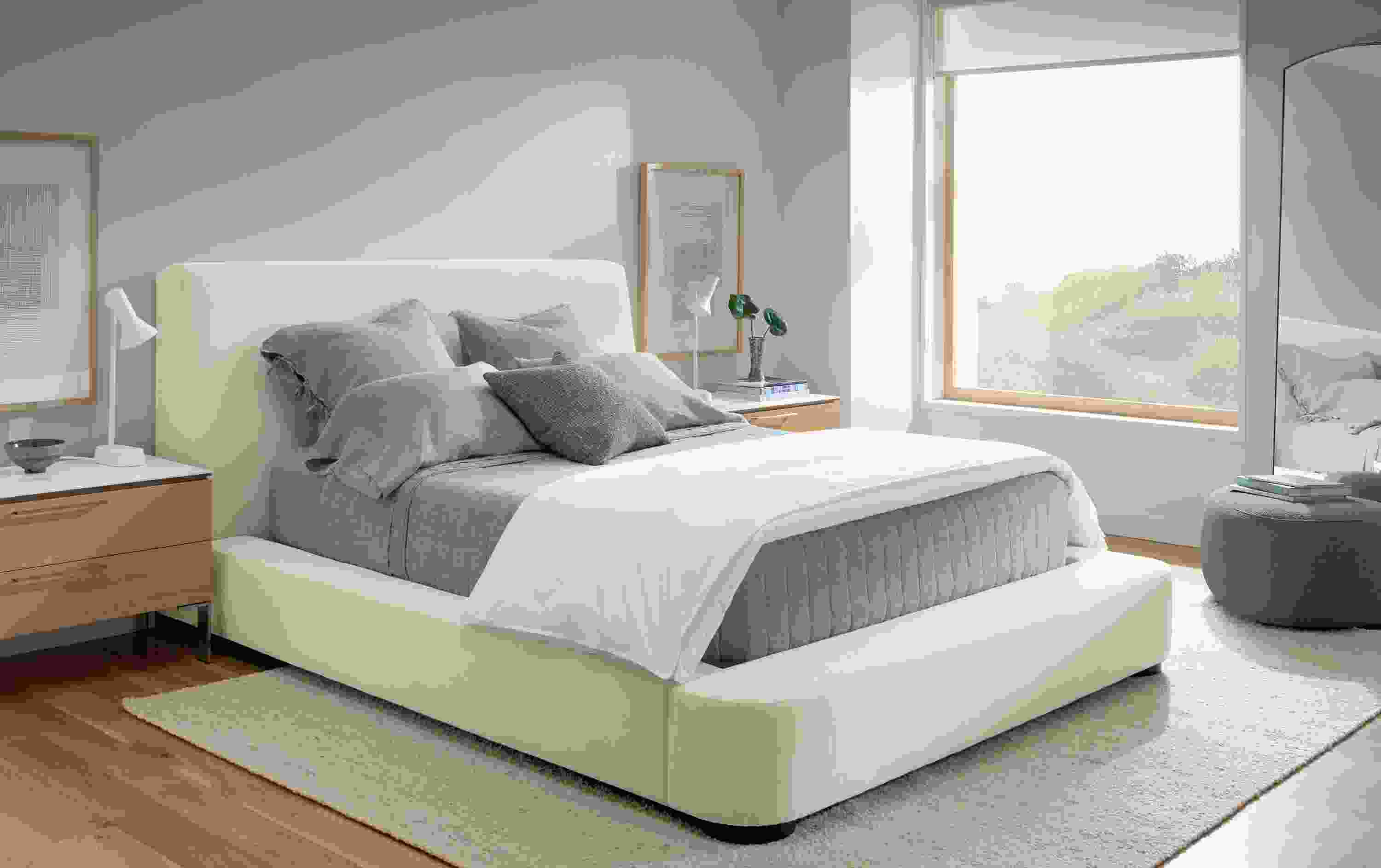 Bedroom with Kai queen bed in Crawford Ivory, 2 Kenwood nightstands in rye on red oak and Sefton rug in cement.