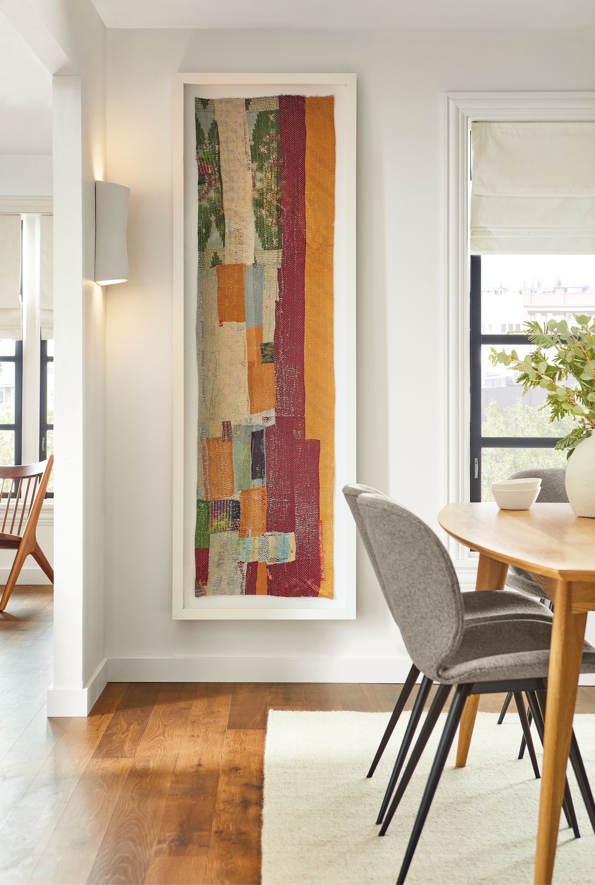 Dining room with Kantha textile in white.