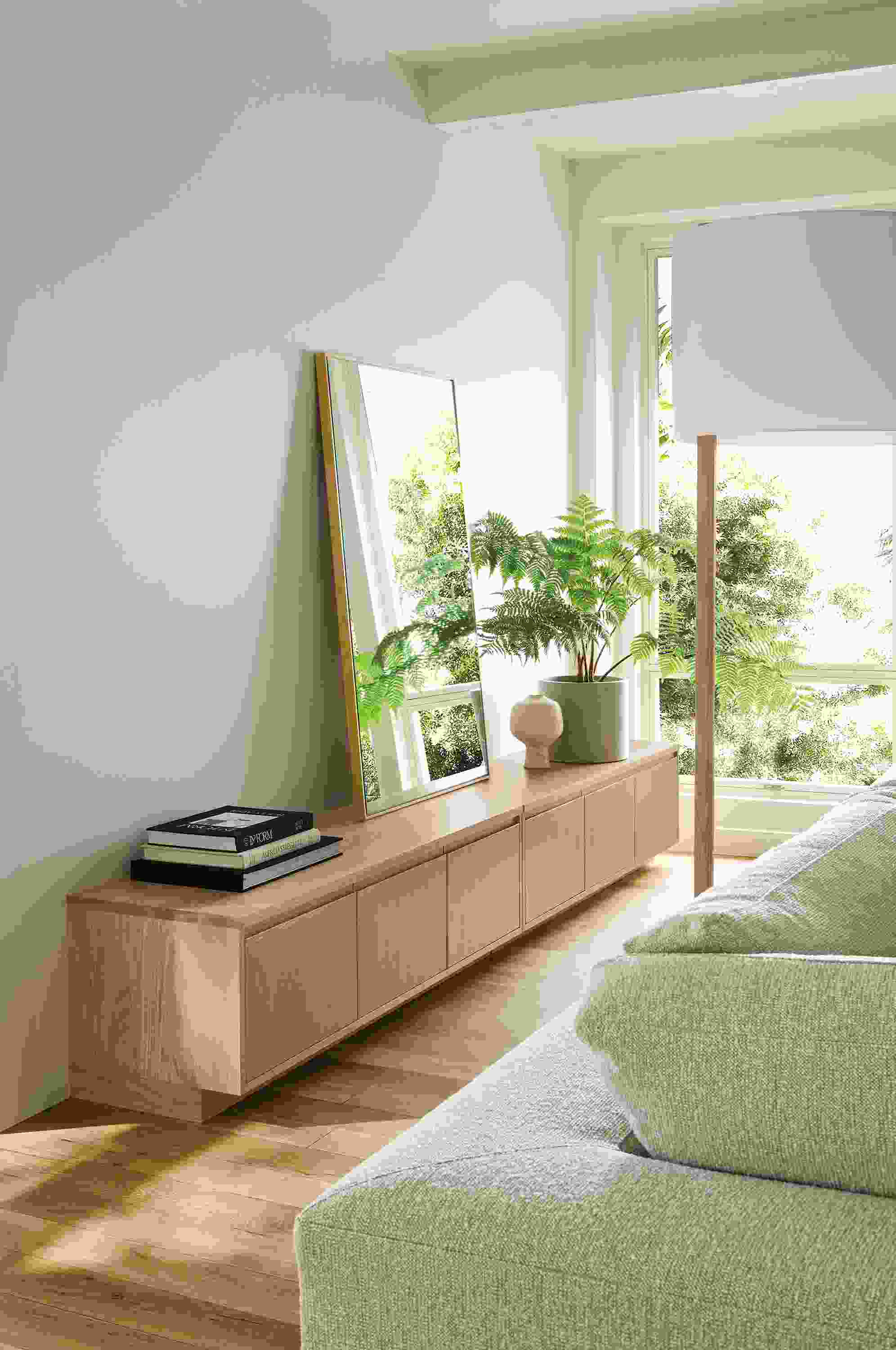 Living room with 2 keaton media cabinets in rye on red oak and everett 72-high floor lamp in rye on red oak.
