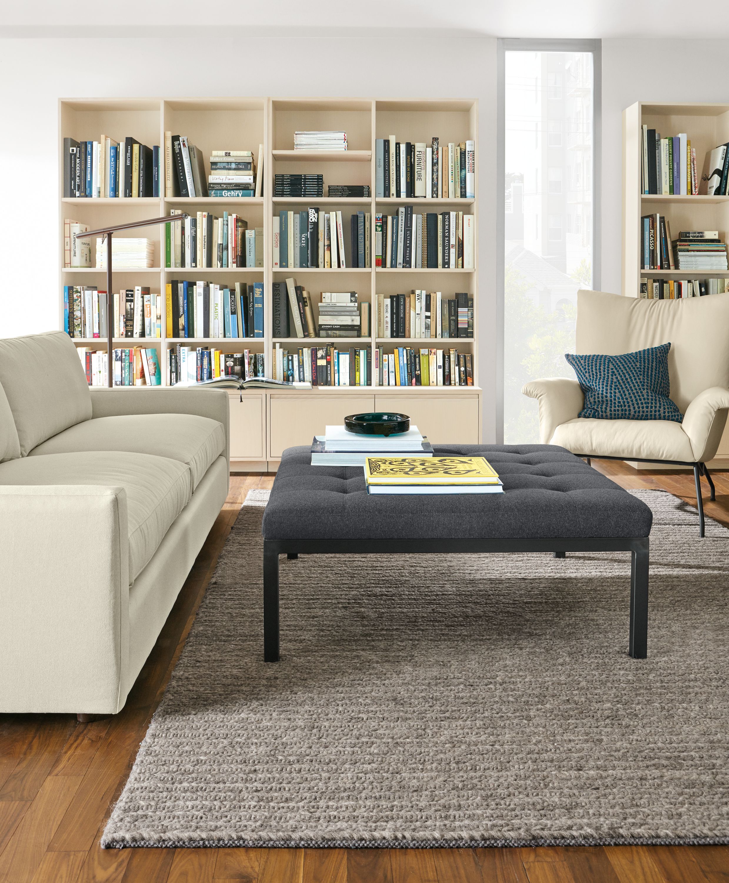 40"w ottoman in Flint charcoal fabric and natural steel base