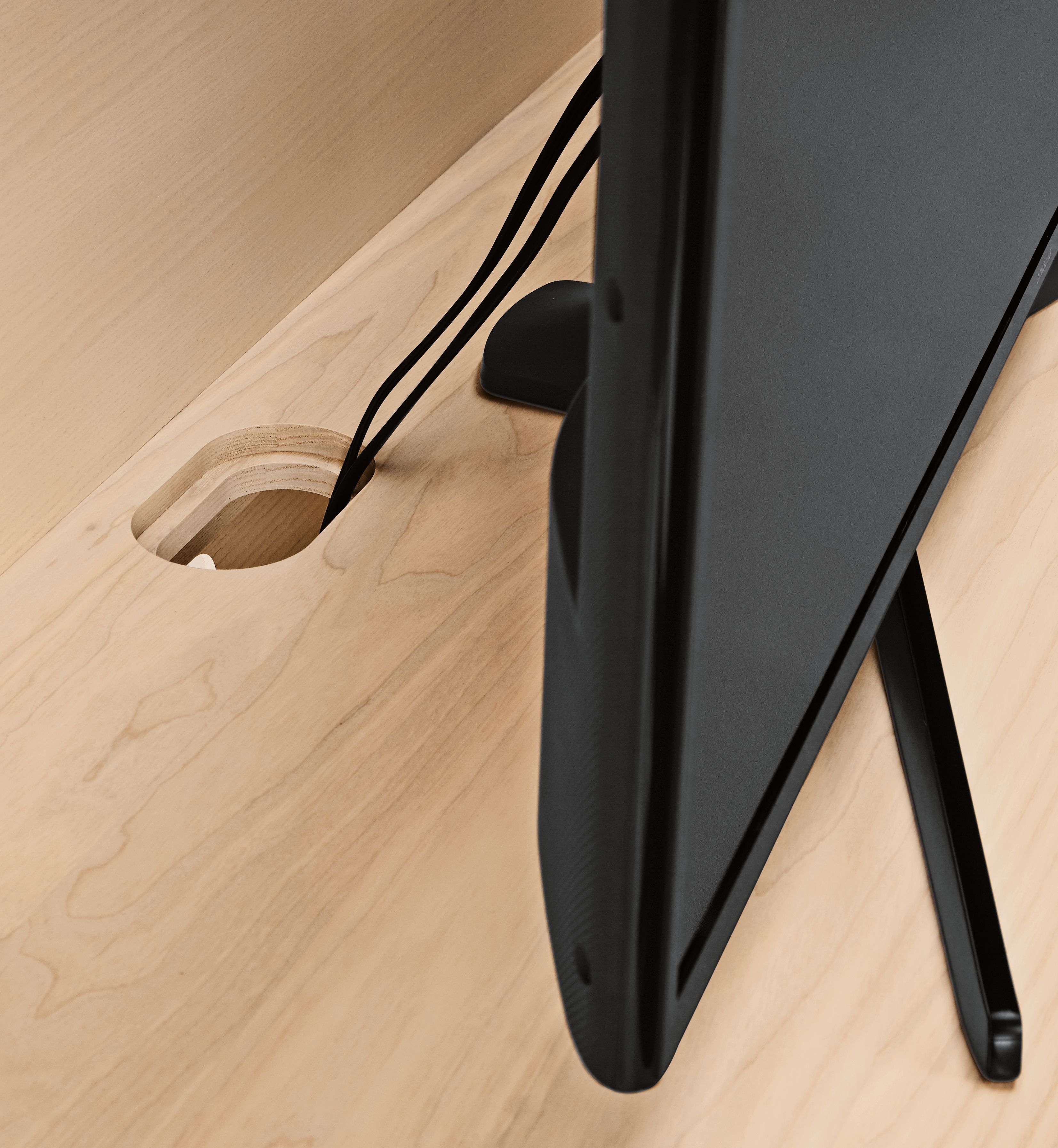 Detail of cord management behind tv for Keaton Media Bookcase.