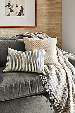detail of kelvin throw pillow and montreal throw pillow on sofa.