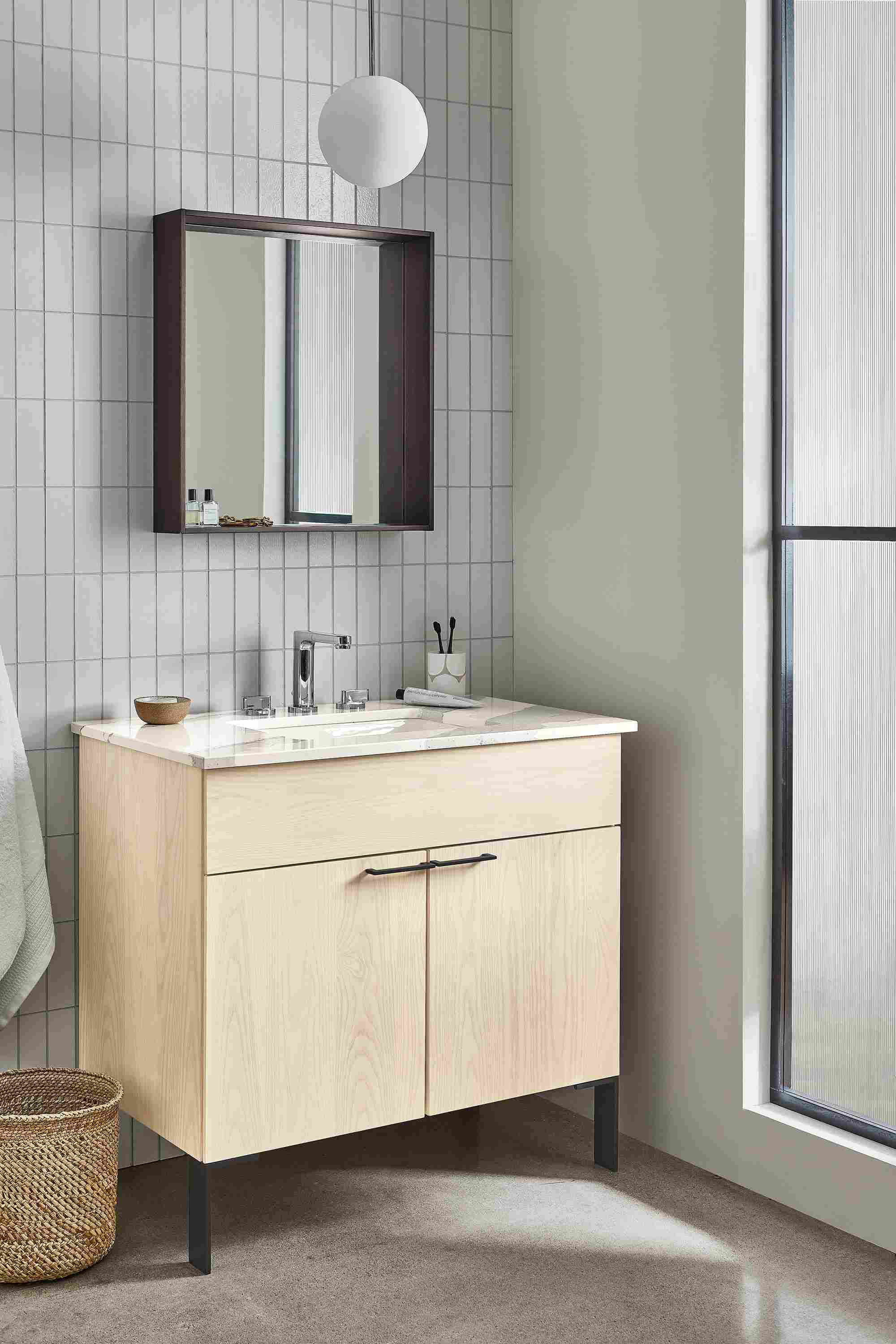 bathroom with kenwood vanity in sand stain with cambria quartz top.