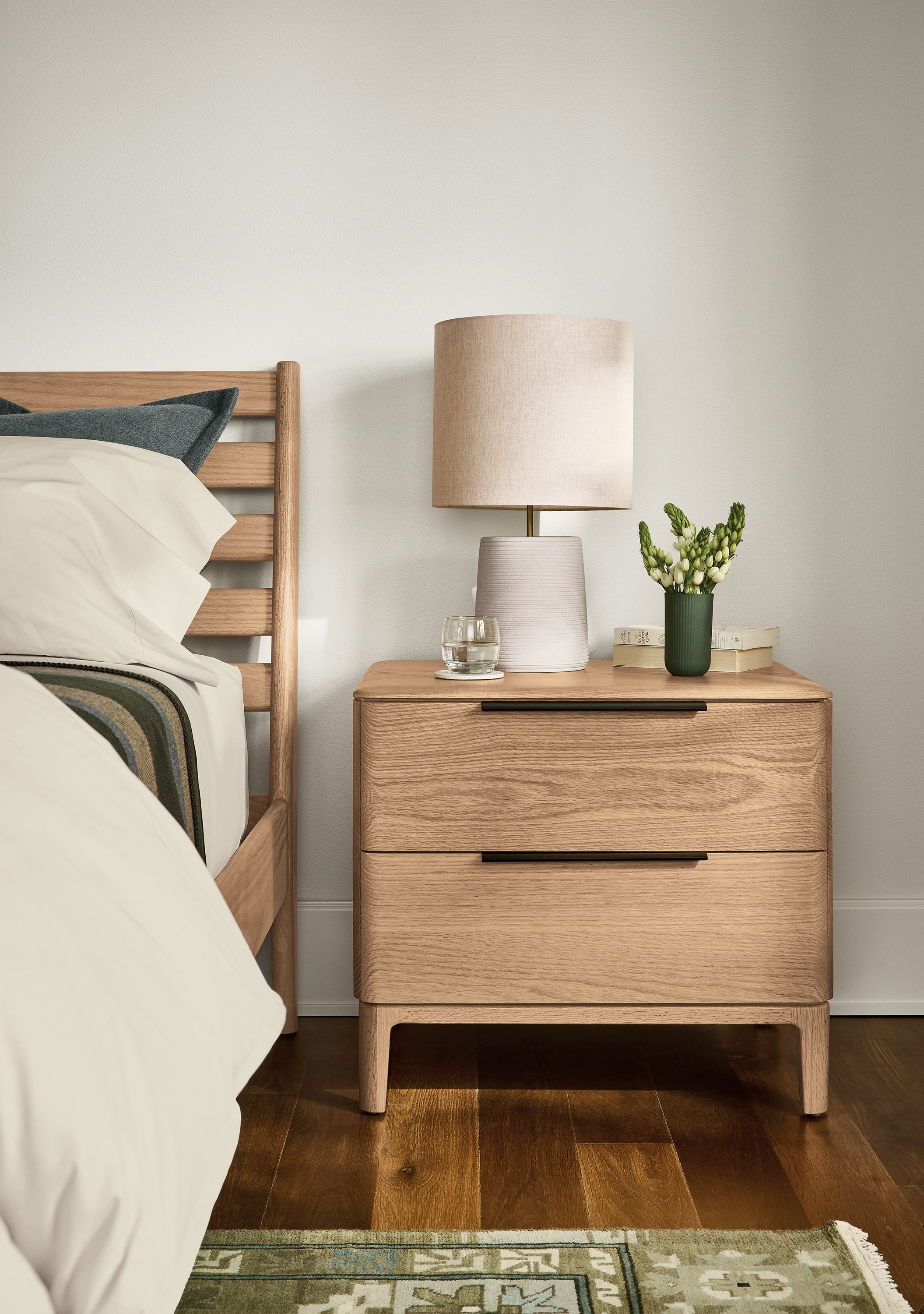Bedroom with Kingston 2-drawer nightstand and Silas king bed in rye on red oak and kayseri rug in moss.
