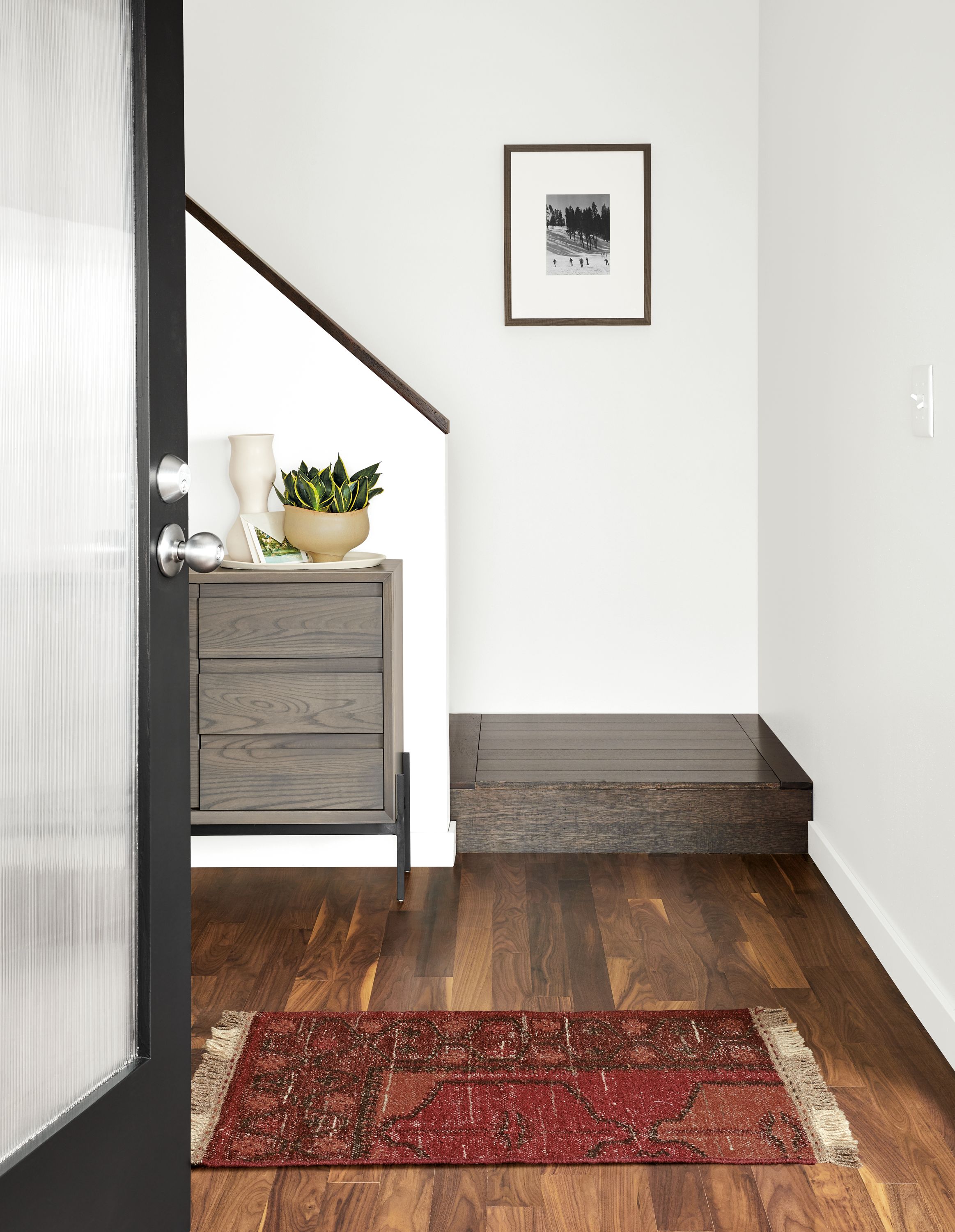 Detail of Kinley cabinet and Tamsa rug in rust.