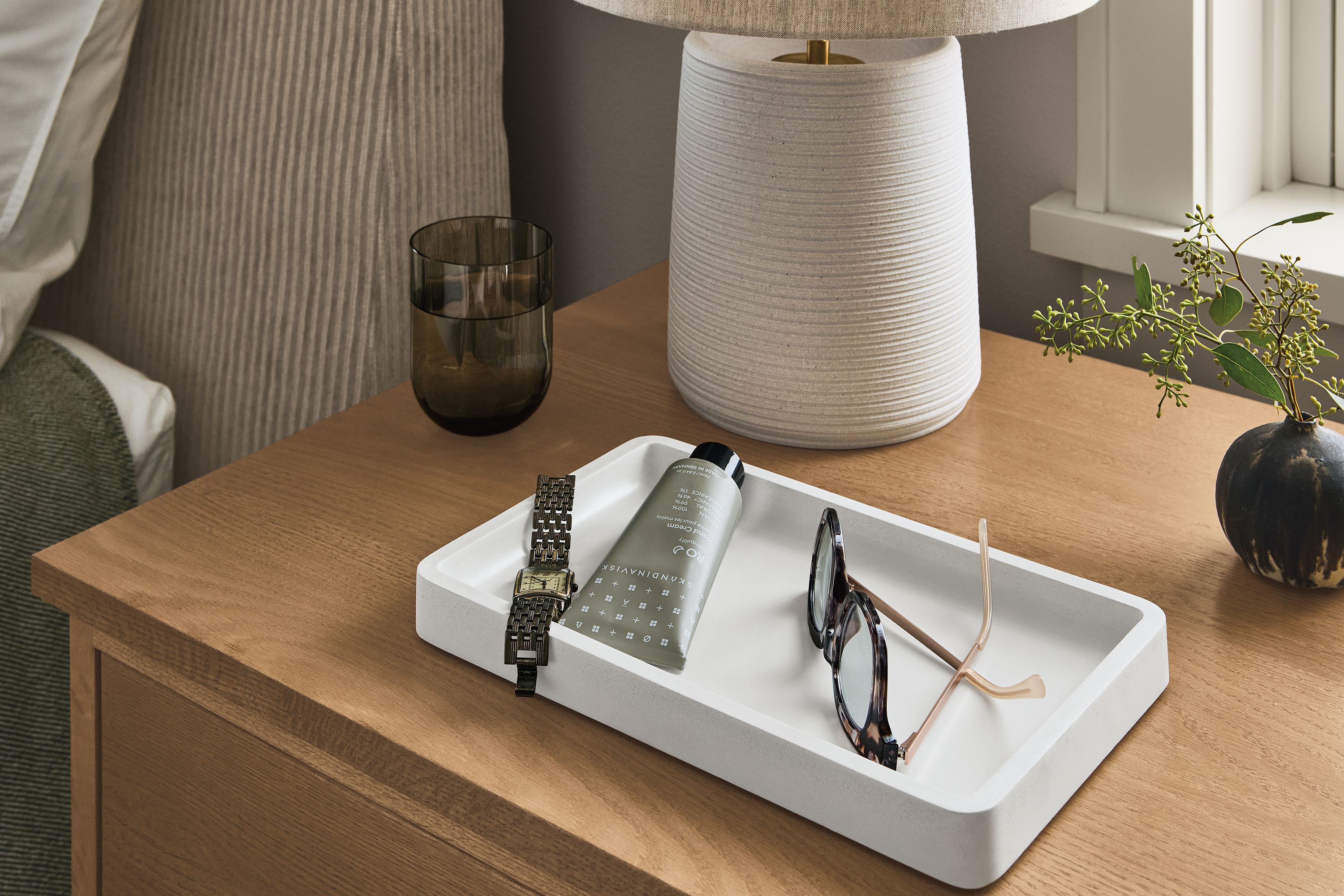 Bedroom with detail of Kiser tray in white on a Linear nightstand in Rye on Red oak.