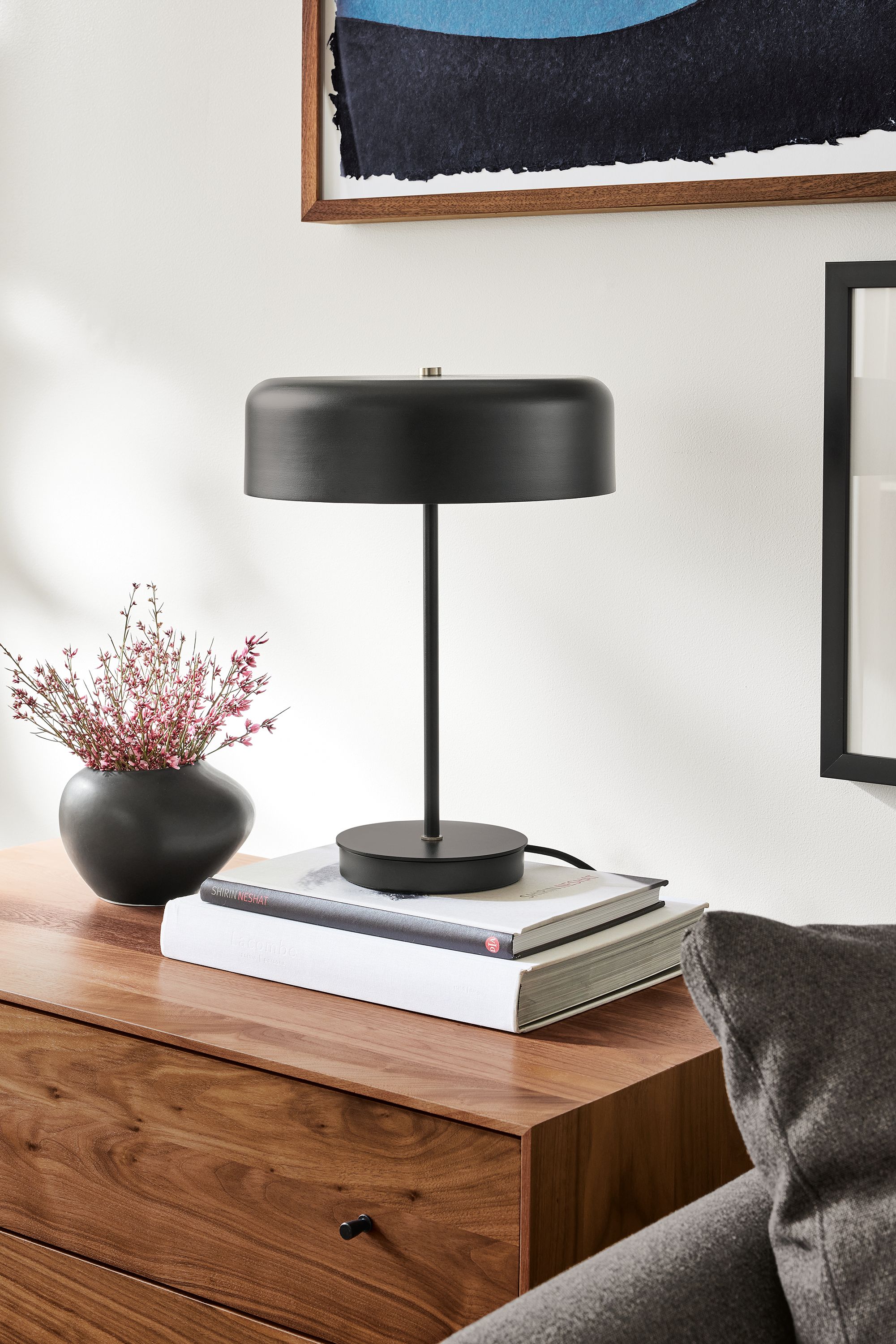 Kylo black table lamp on a Hudson three-drawer dresser in walnut detail.