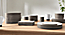 detail of stacked Lagoa dinner plates, bowls and cups on tabletop.