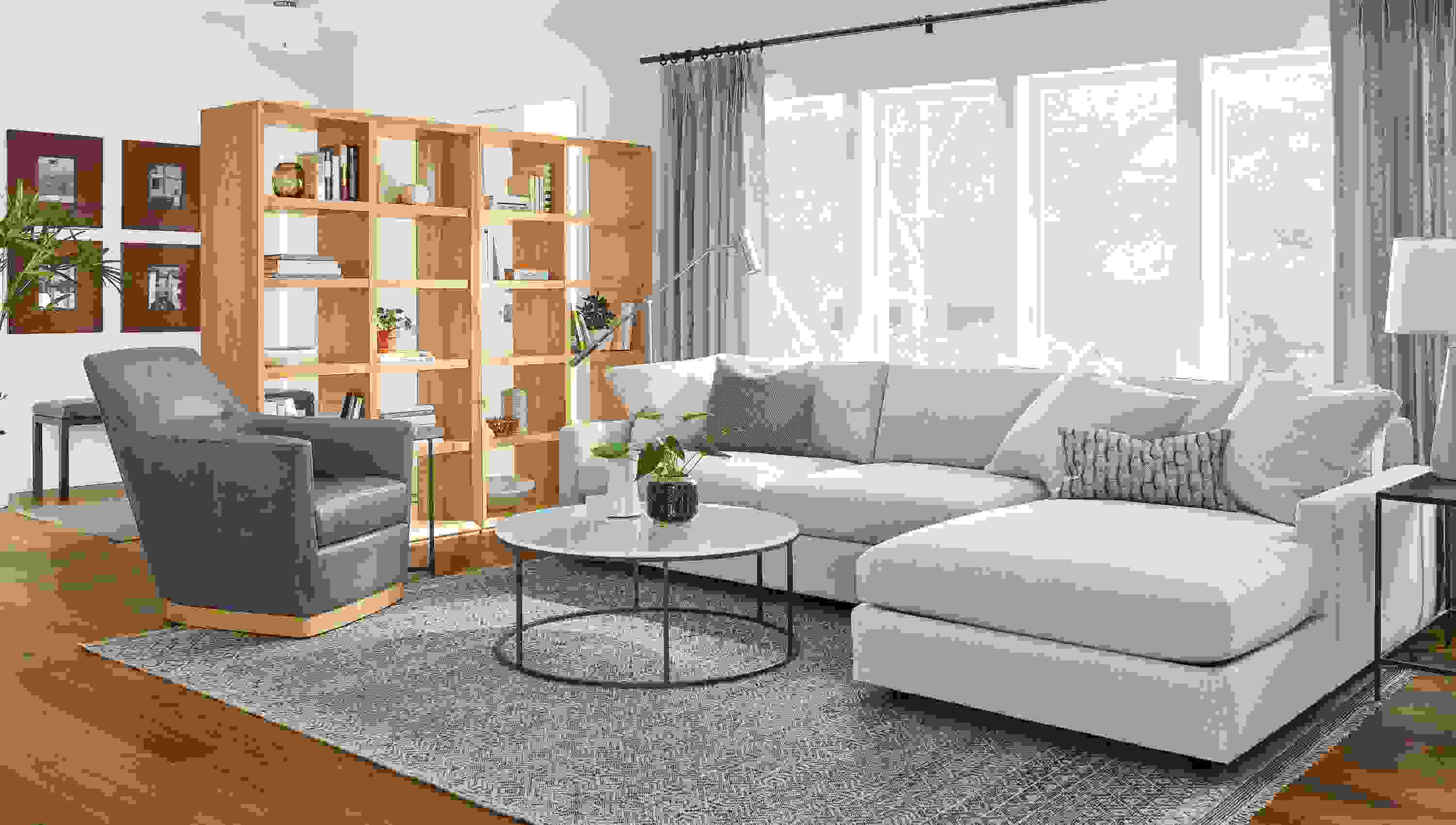 Detail of living room with Lennox bookcases, Markus chair and Linger sofa with chaise.