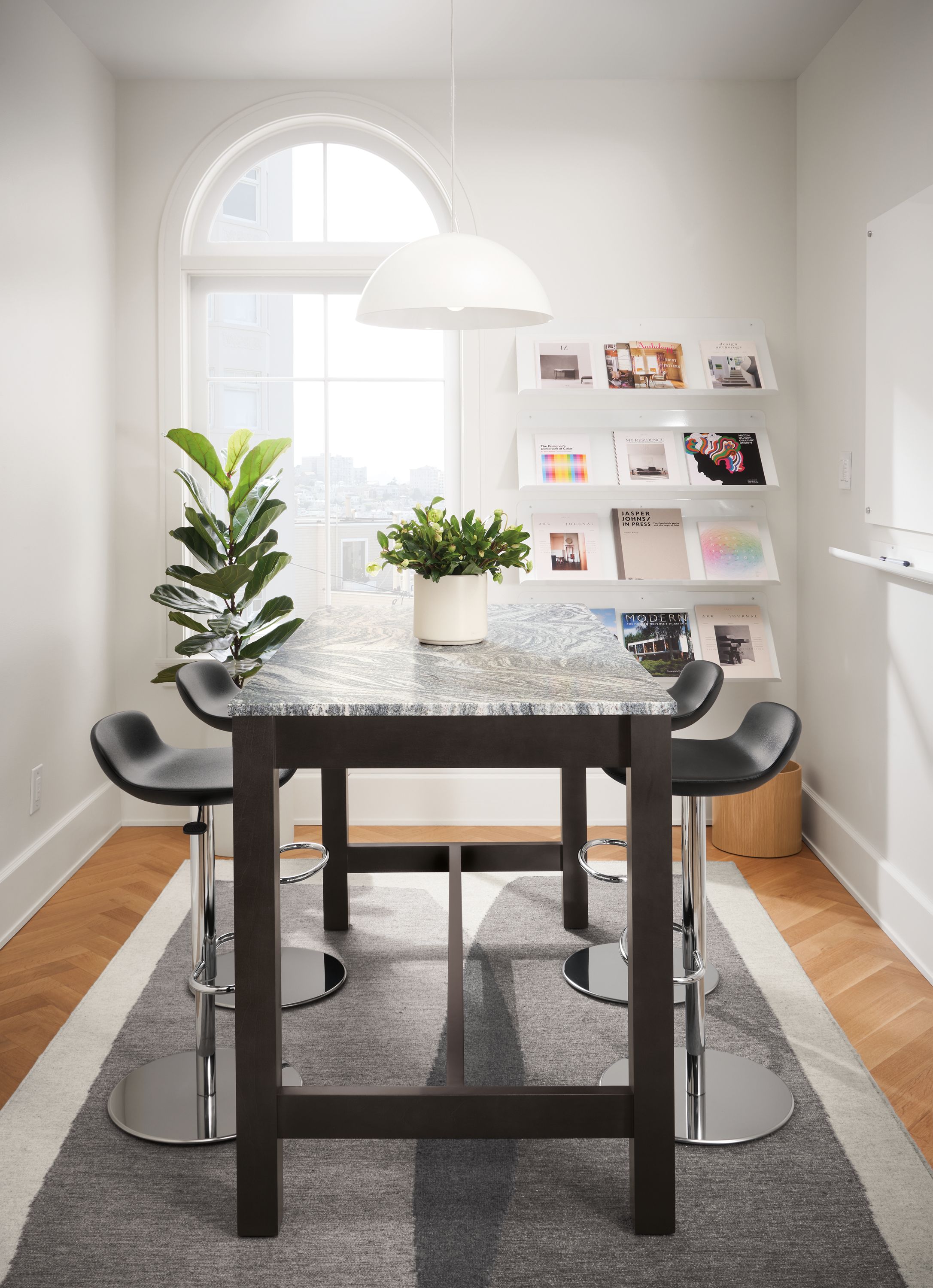 small dining room with linden counter table and 4 leo swivel stools.