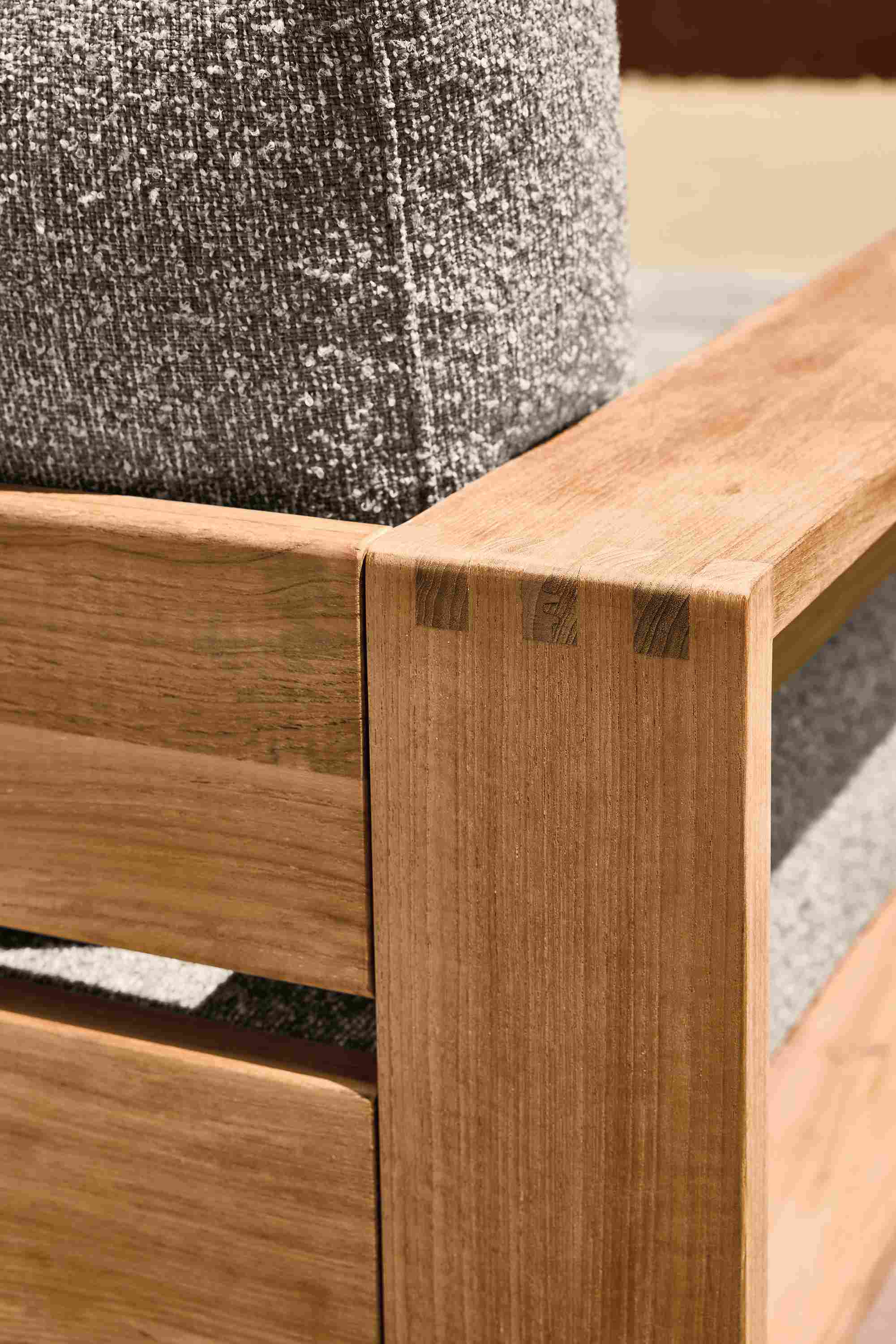 Detail of corner joinery on a Leti lounge chair in Teak Heartwood and Kloss Otter.