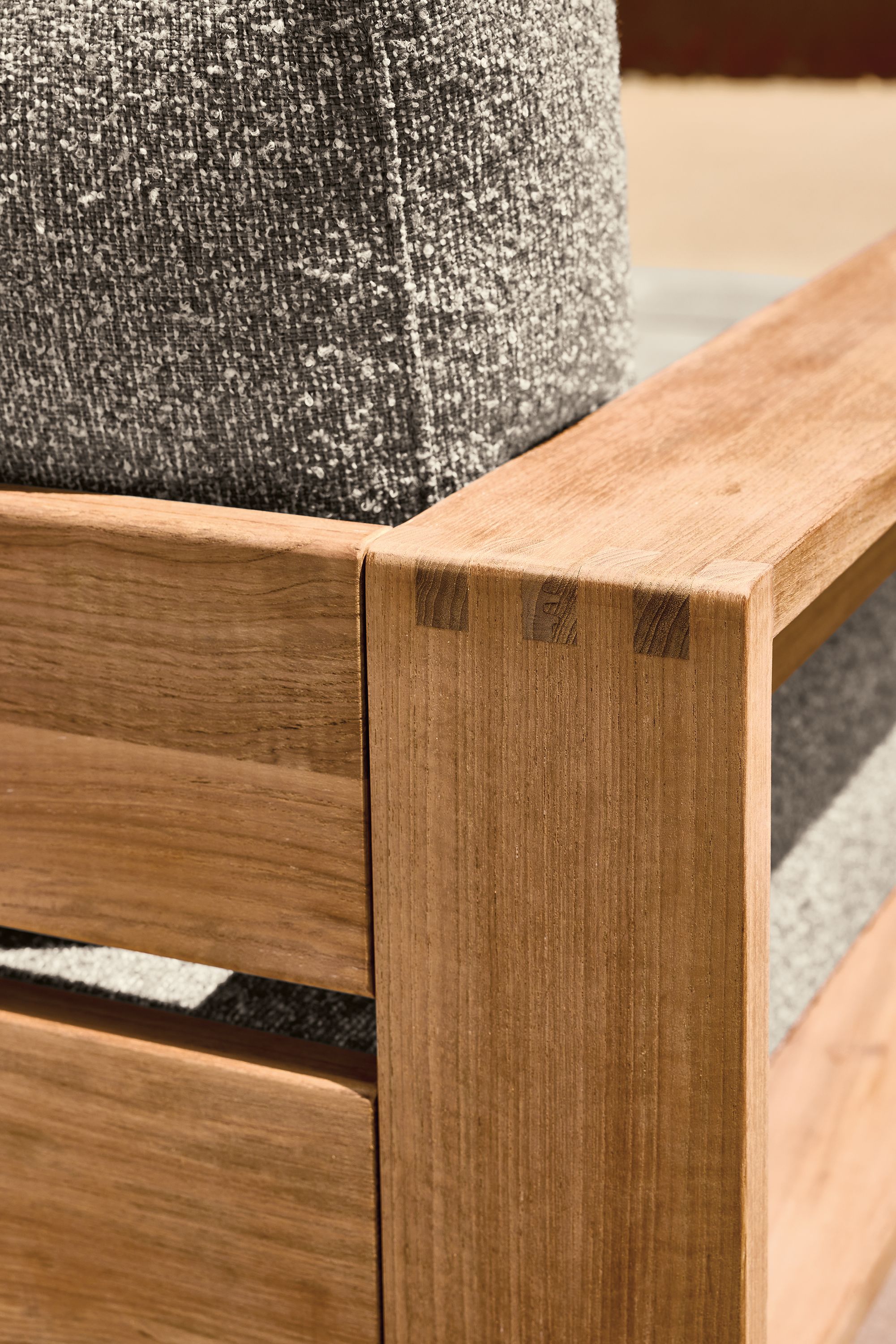 Detail of corner joinery on a Leti lounge chair in Teak Heartwood and Kloss Otter.