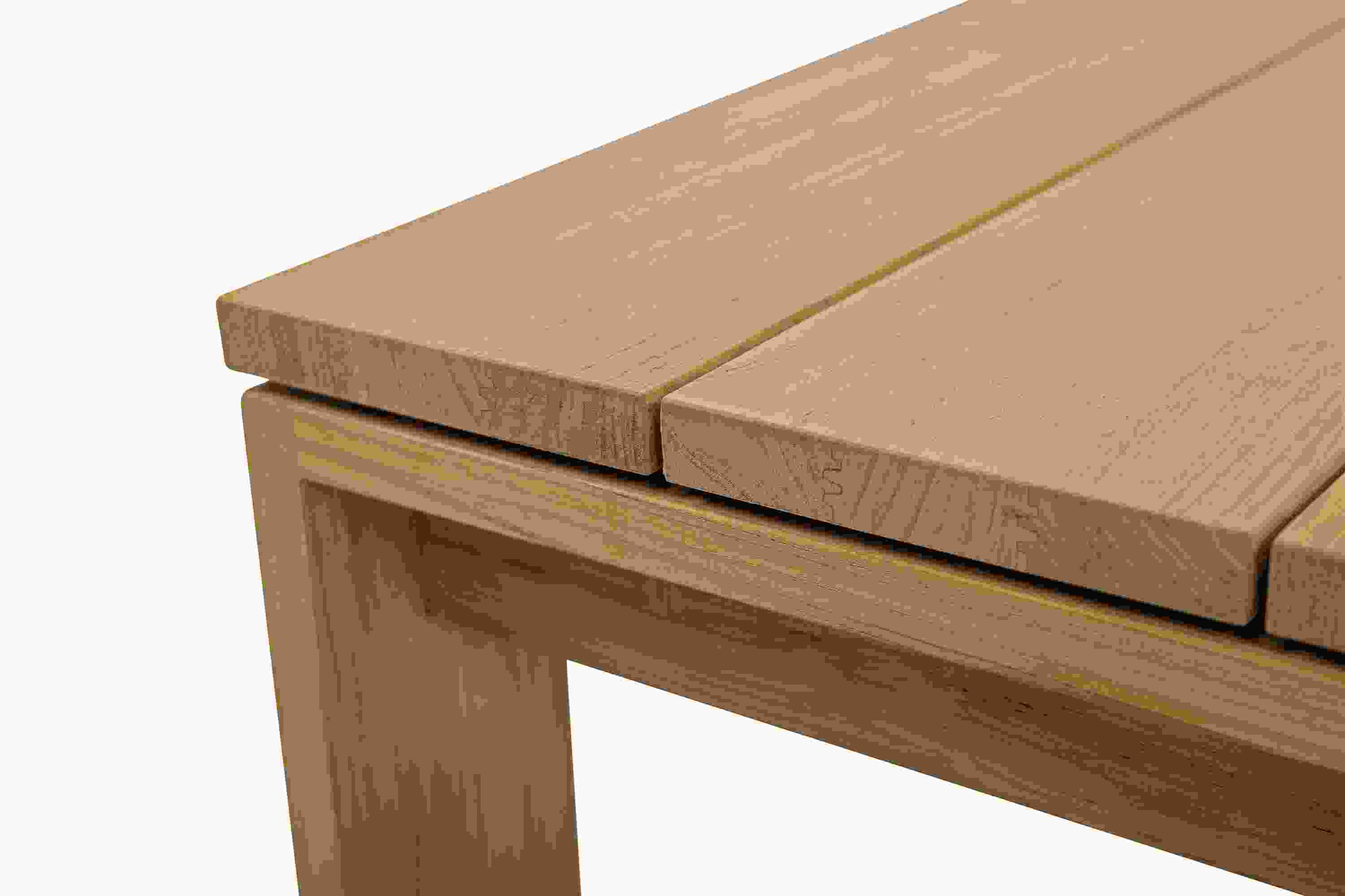 Detail of the corner of a Leti 50-wide coffee table in teak heartwood.