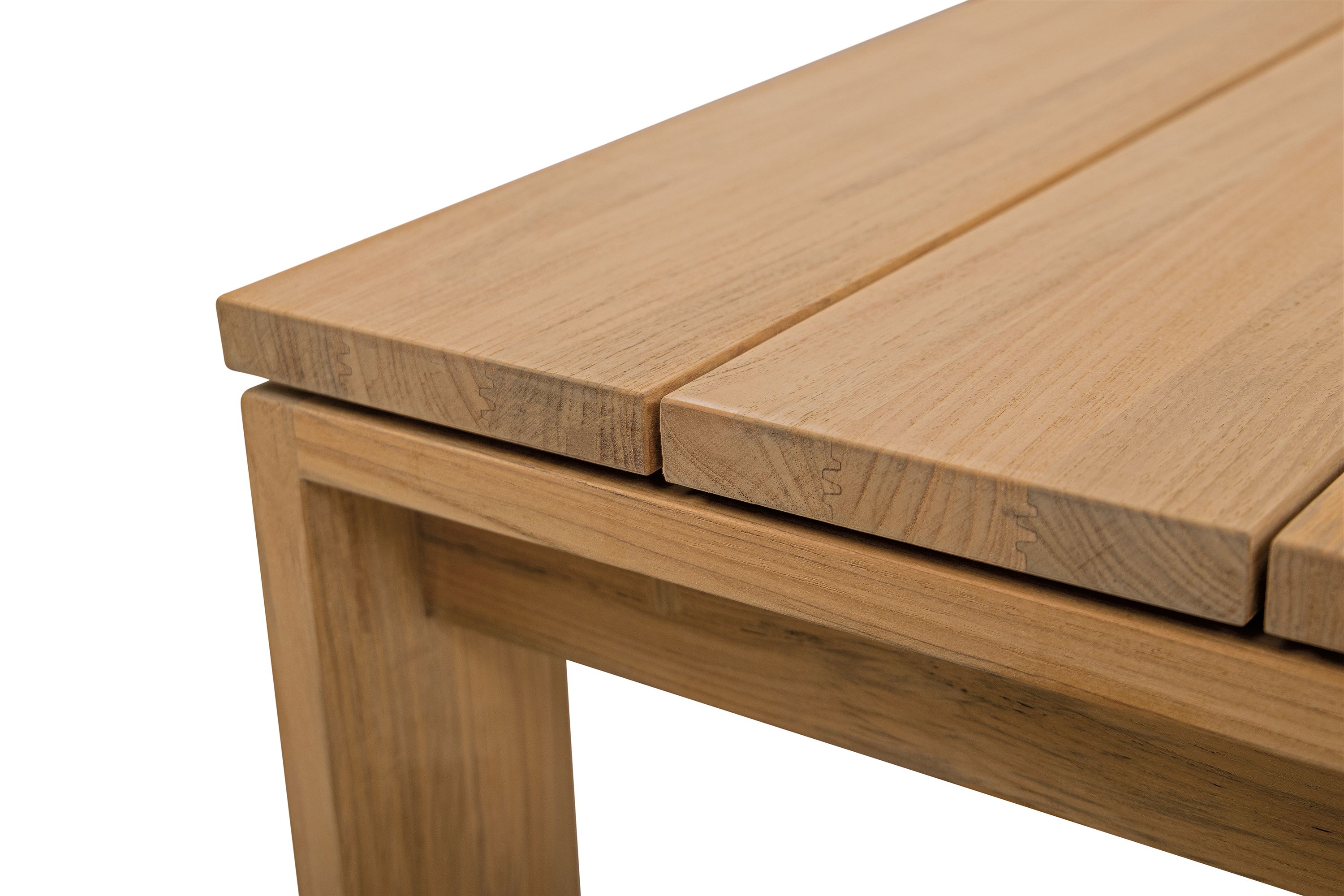 Detail of the corner of a Leti 50-wide coffee table in teak heartwood.