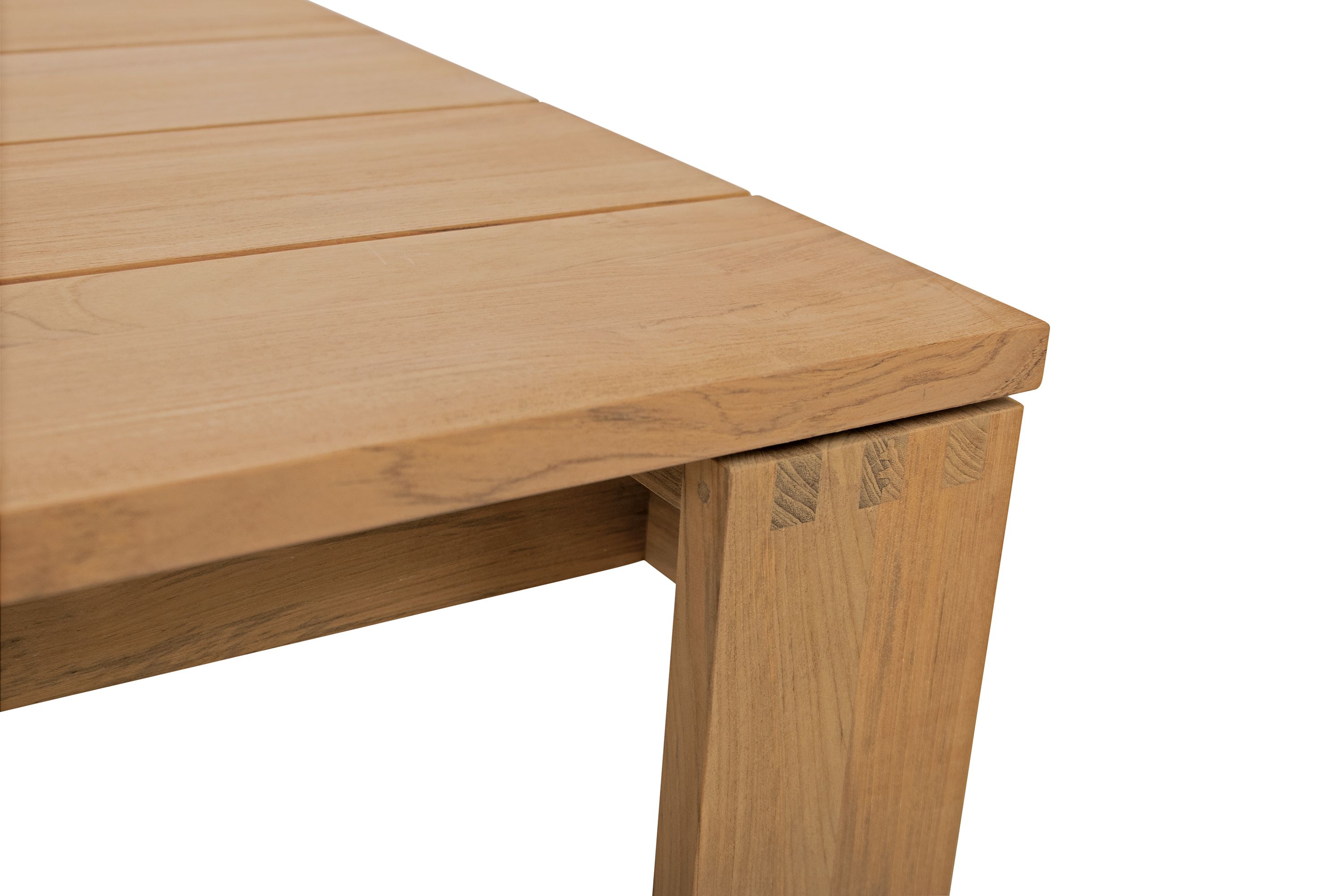 Detail of leg and top joinery on a Leti 50-wide coffee table in teak heartwood.